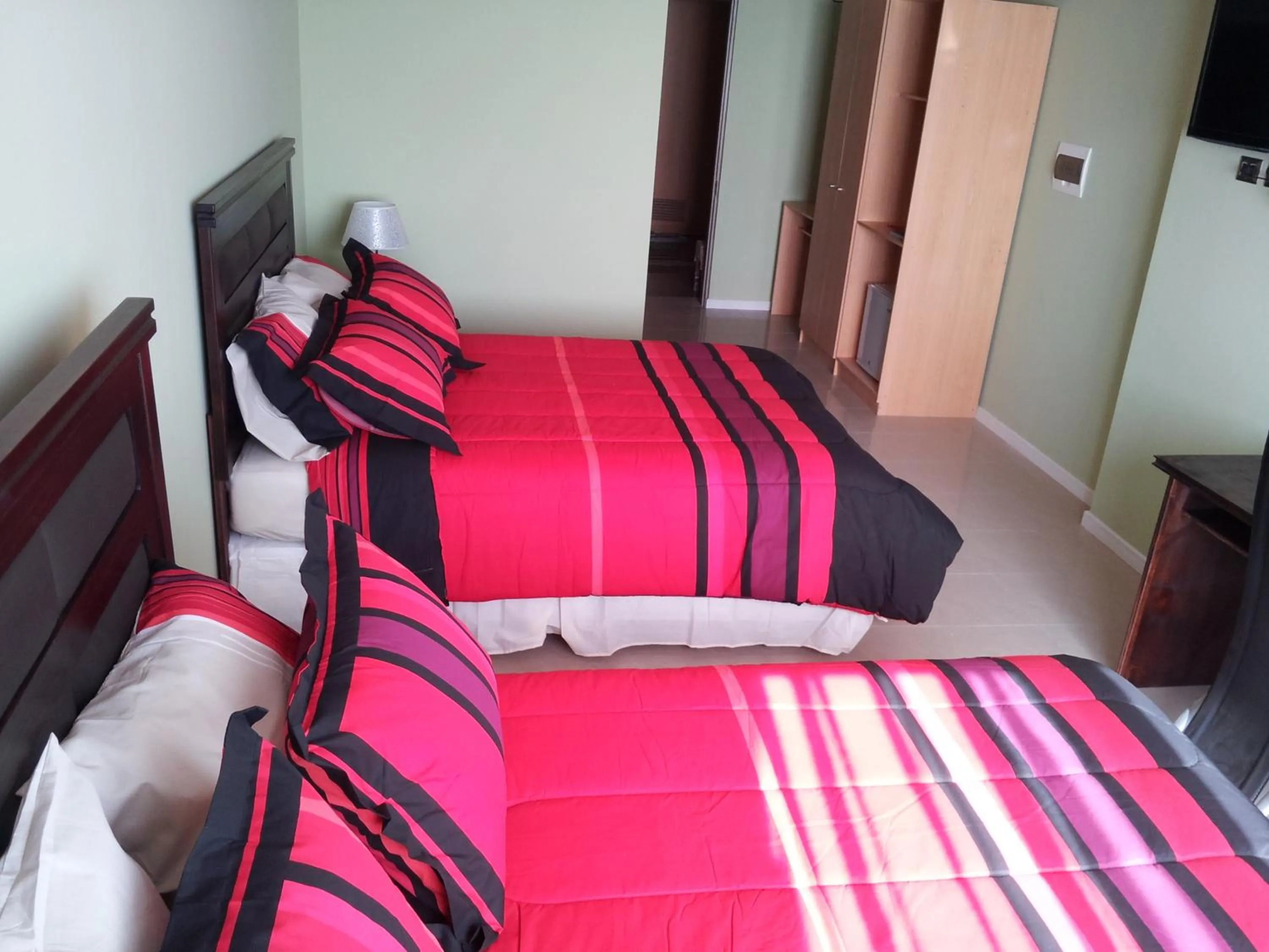 Bed in Hotel Astore Suites