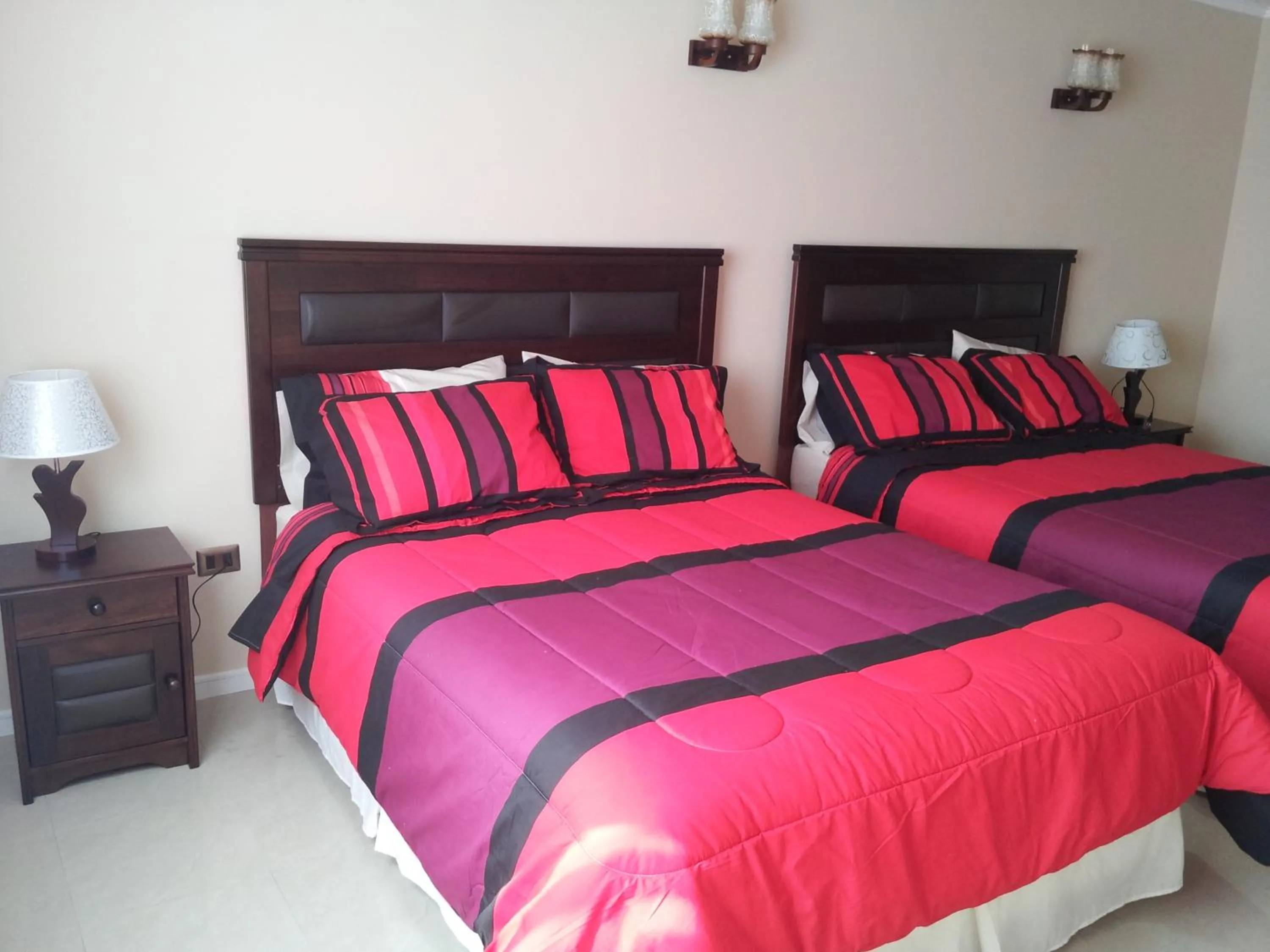 Bed in Hotel Astore Suites