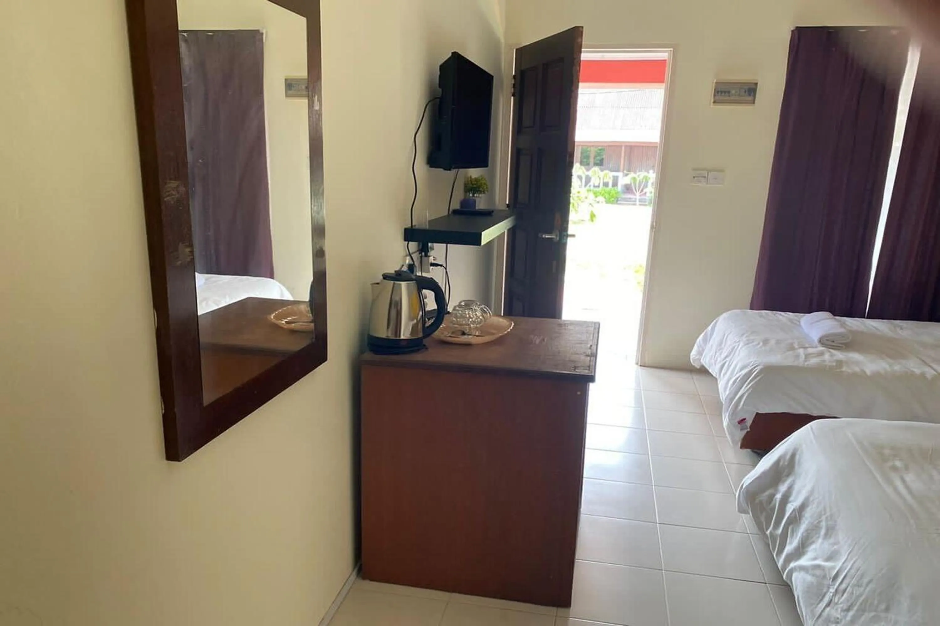 Bed in Corrie Chalet Pantai Cenang Langkawi