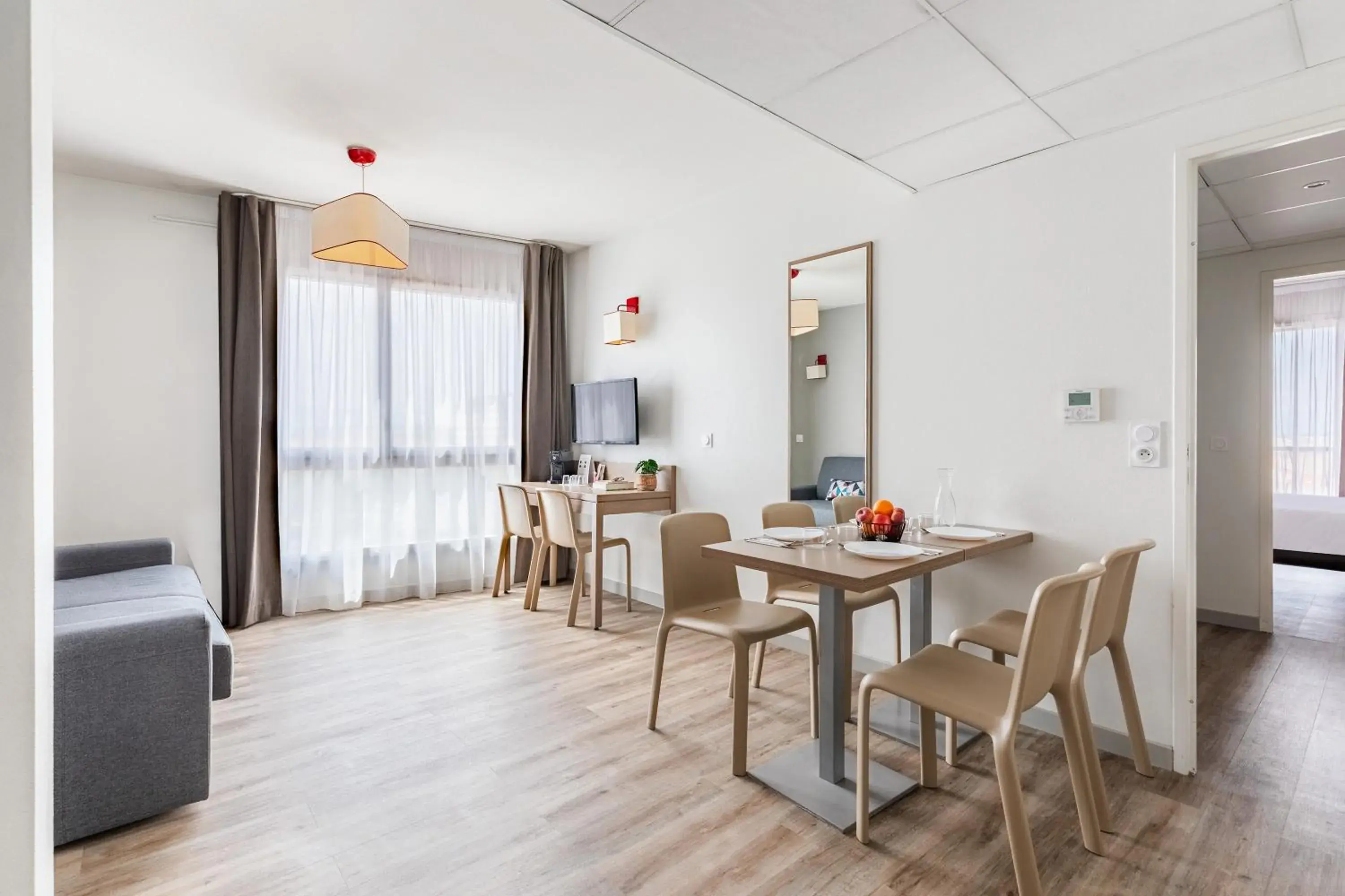 Living room in Appart'City Confort Perpignan Centre Gare Living room in Appart'City Confort Perpignan Centre Gare