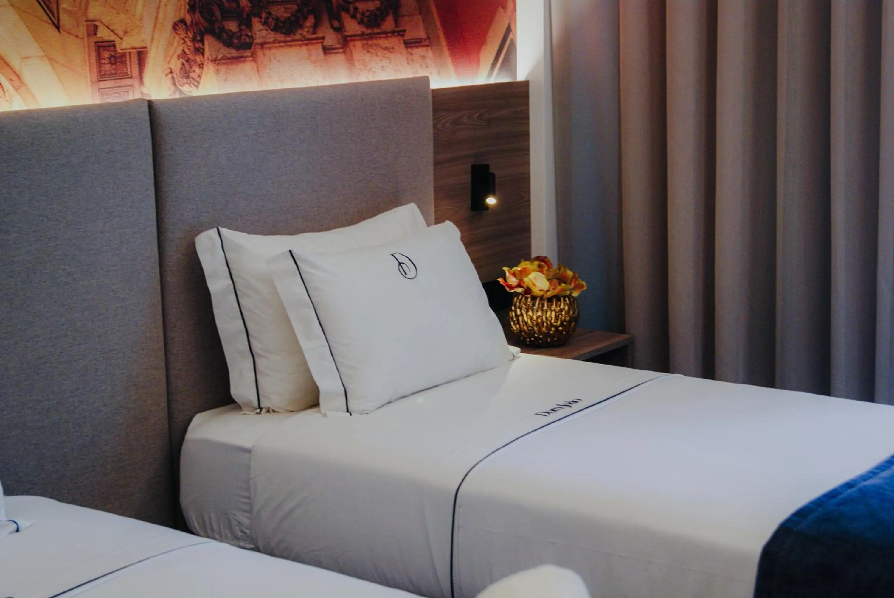 Bed in Dom João Glamour Hotel