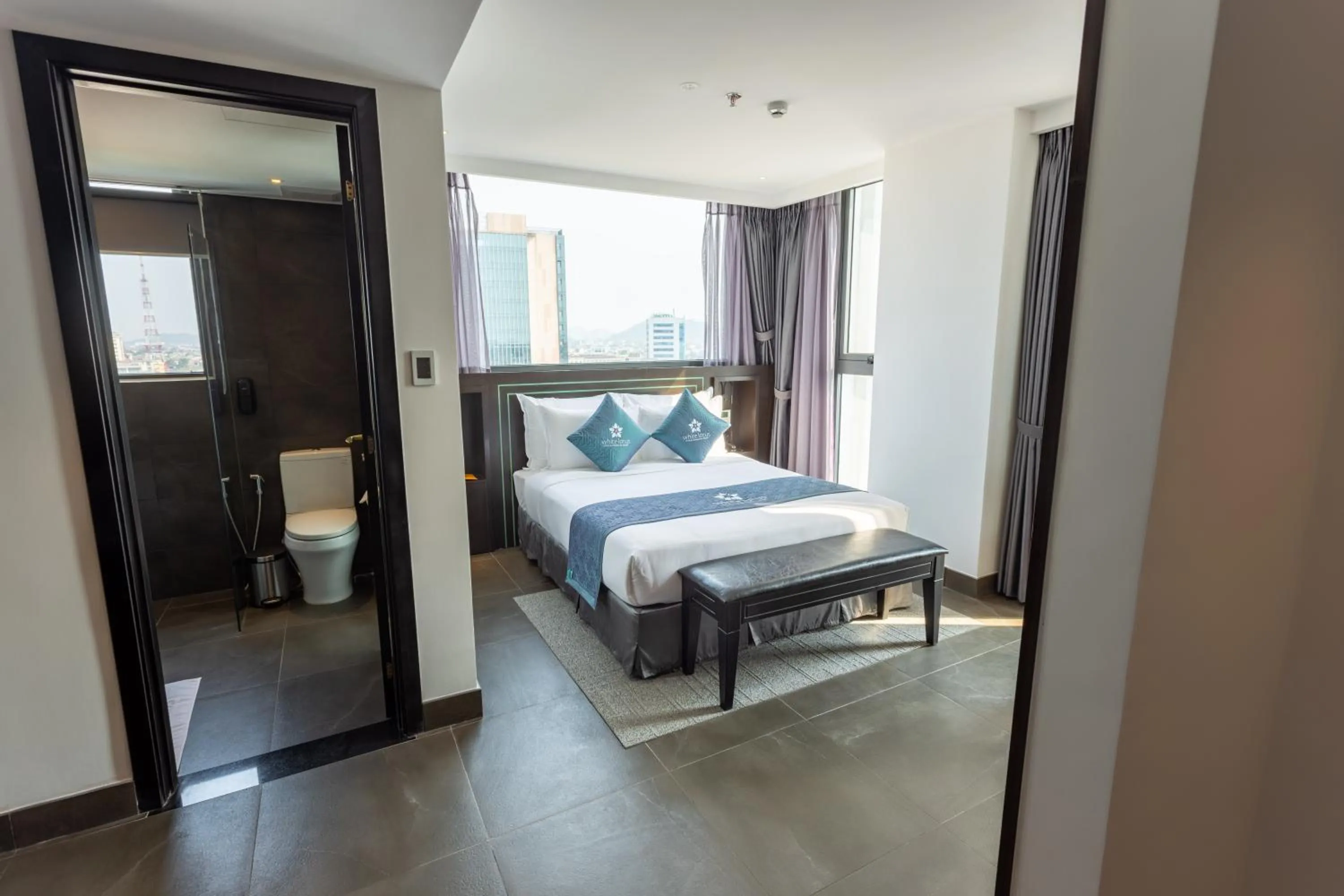 Photo of the whole room, Bed in White Lotus Hue Hotel