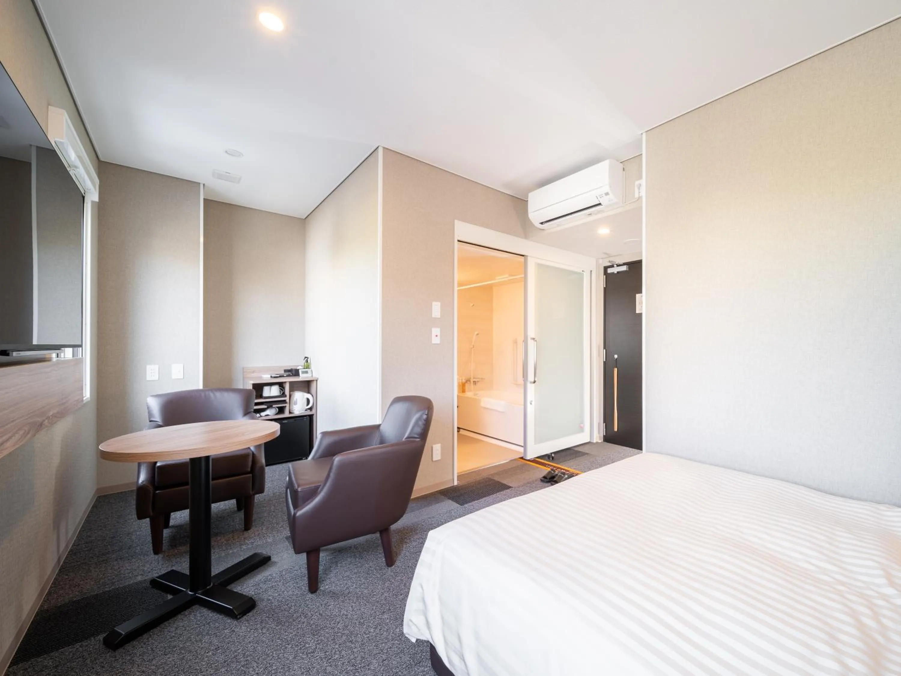 Living room, Bed in Super Hotel Higashi-Maizuru