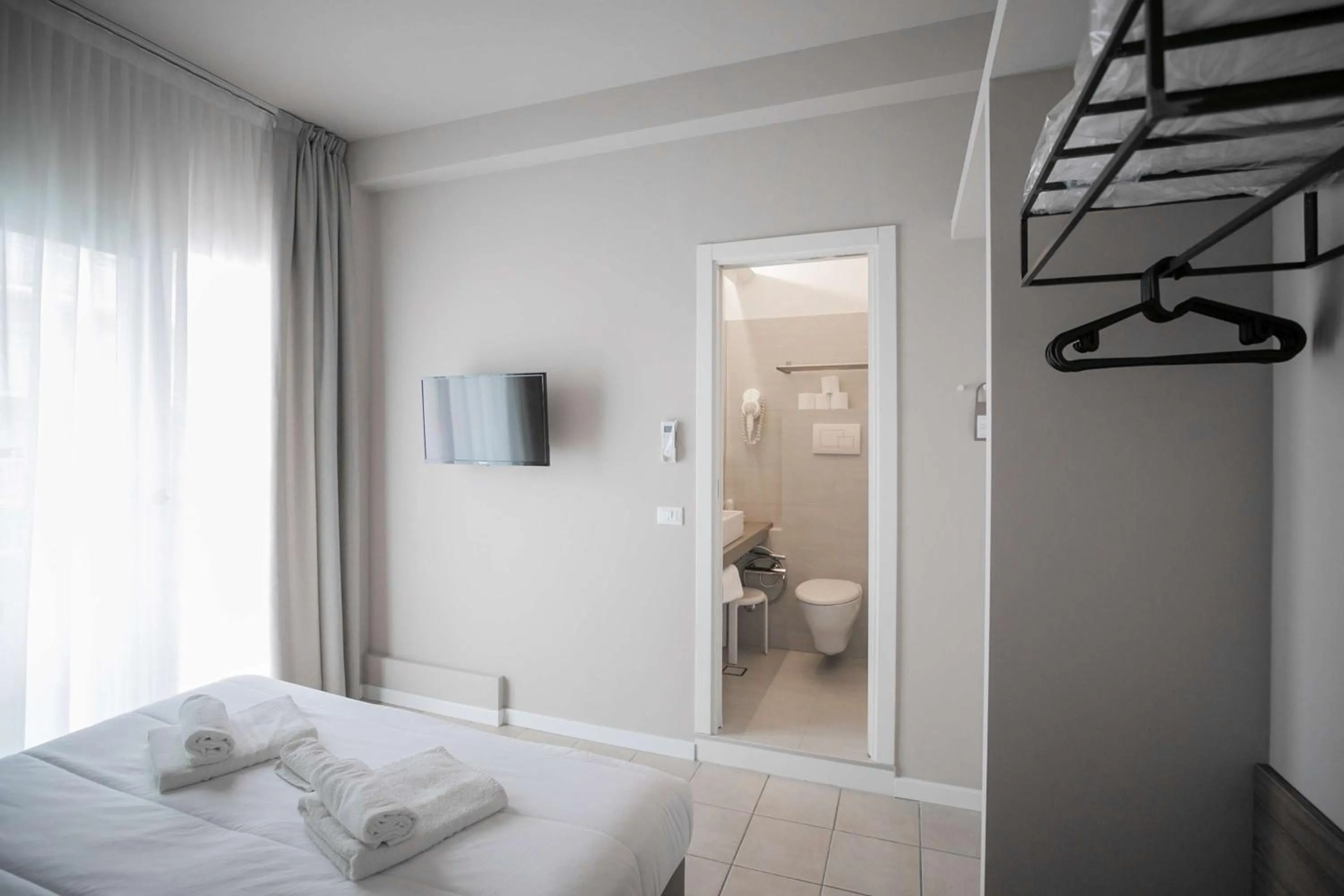 Bed in Hotel Benvenuto