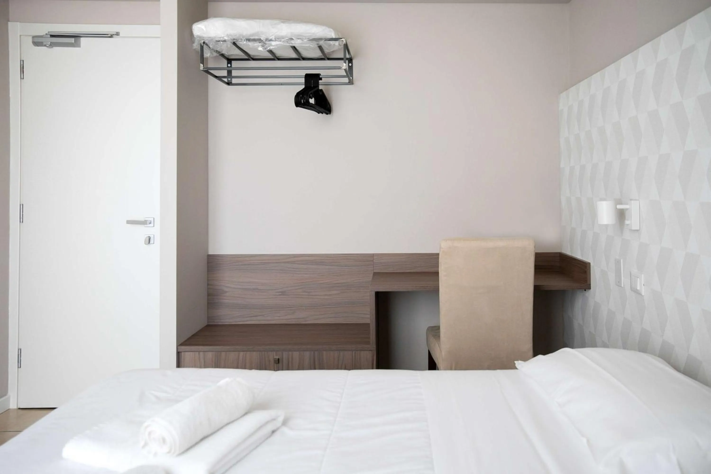 Bed in Hotel Benvenuto