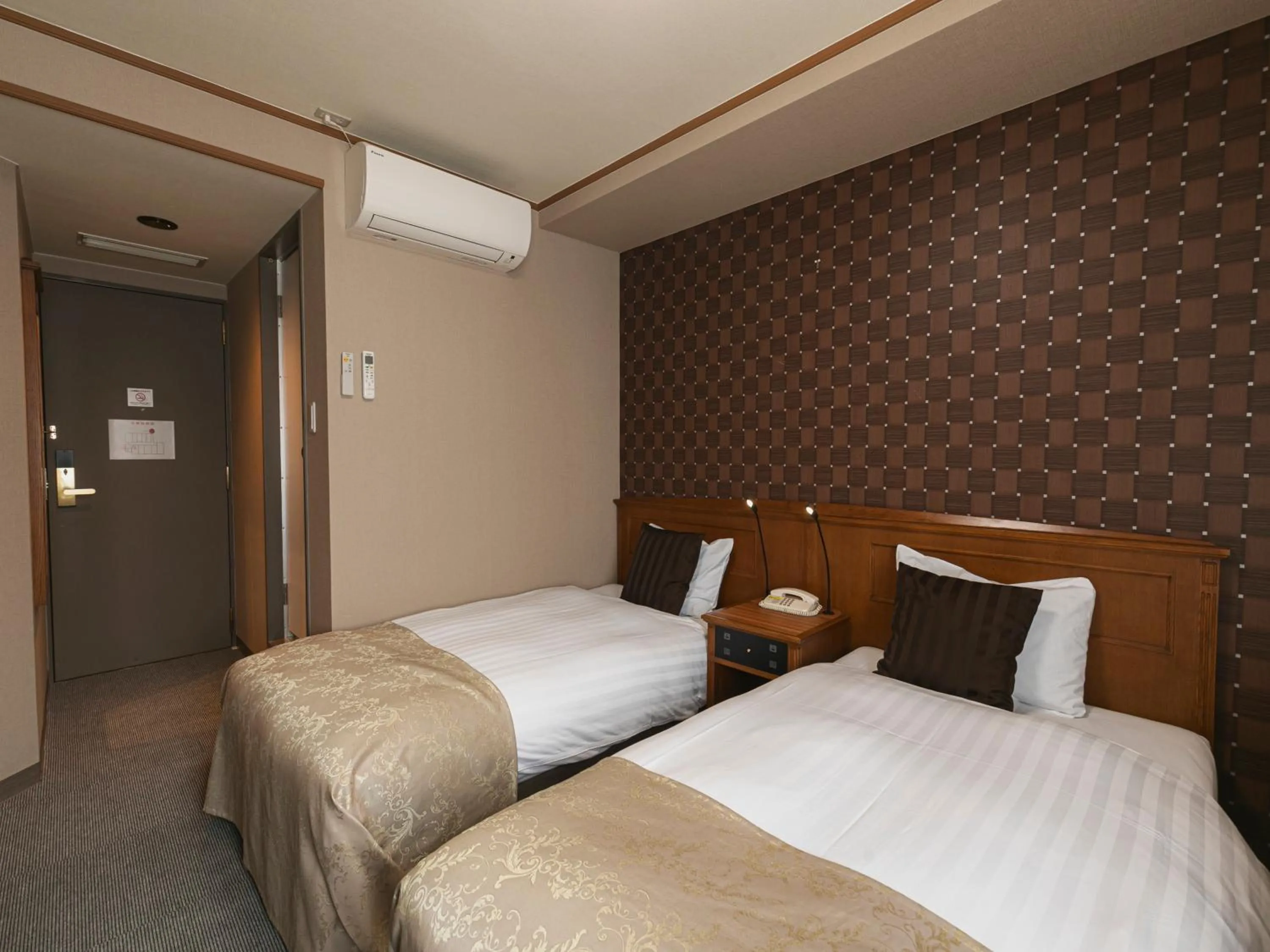 Bed in Hotel Arthur KITAHAMA BASE