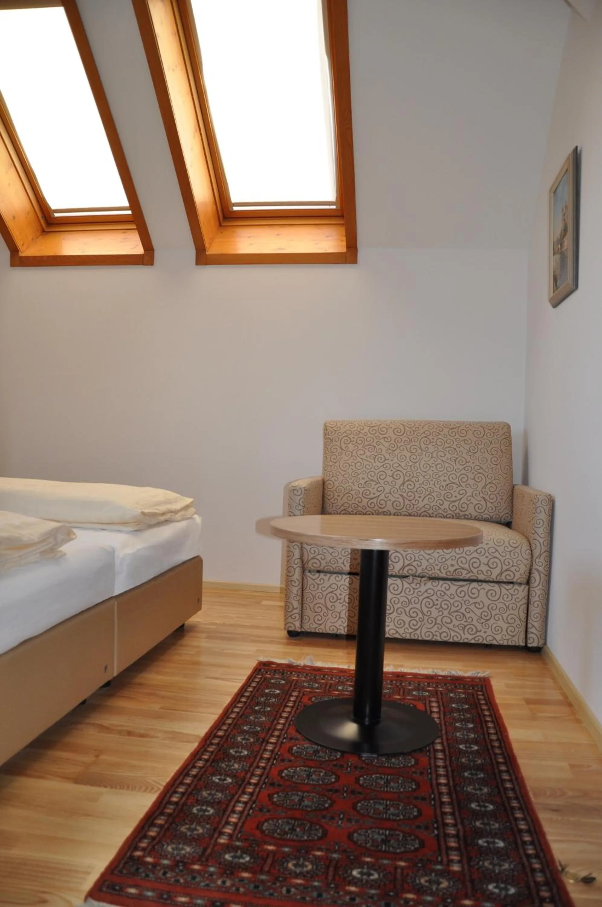 Seating area, Bed in Hotel Almtalerhof