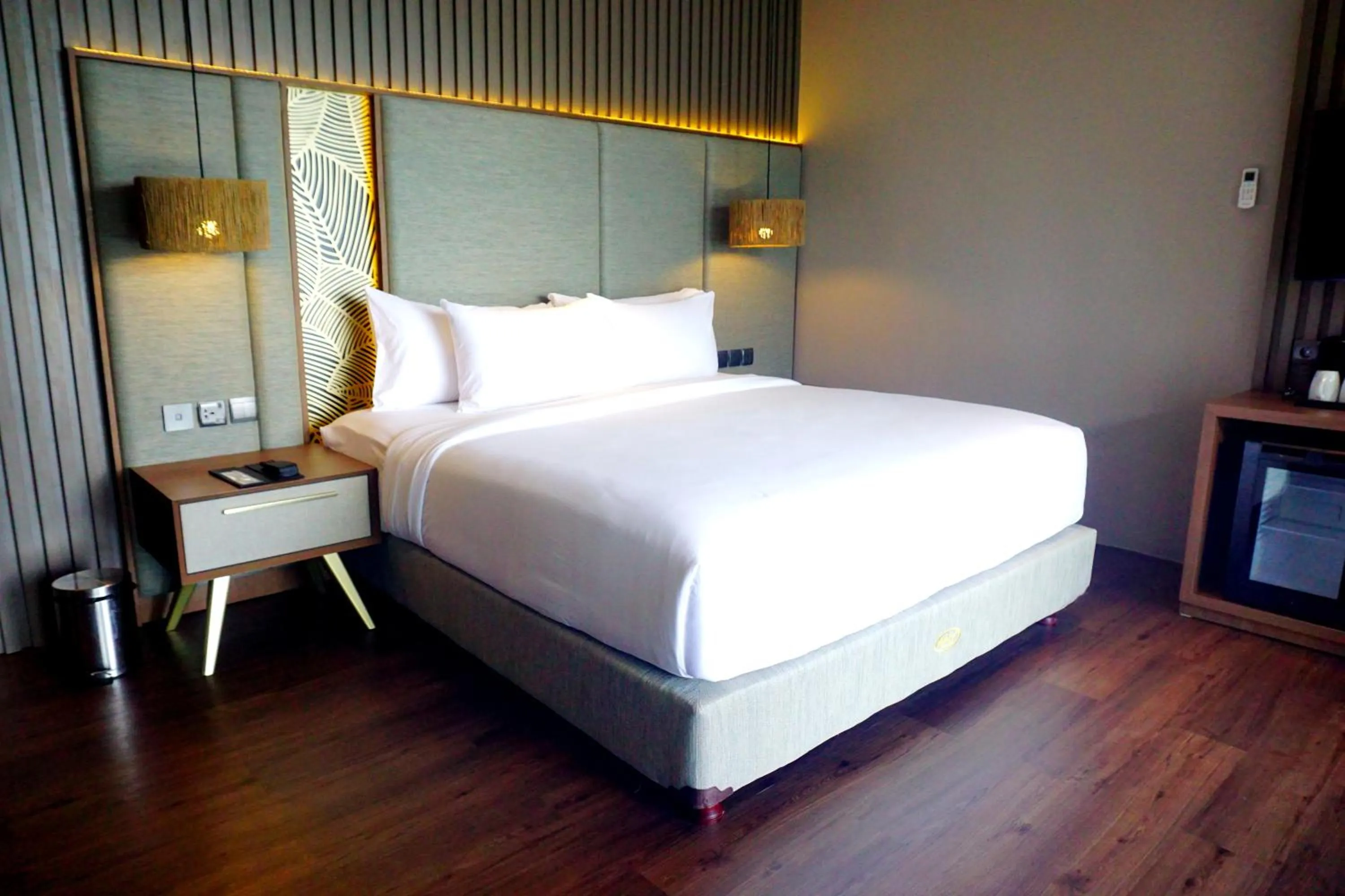 Bed in The Balcone Suites & Resort