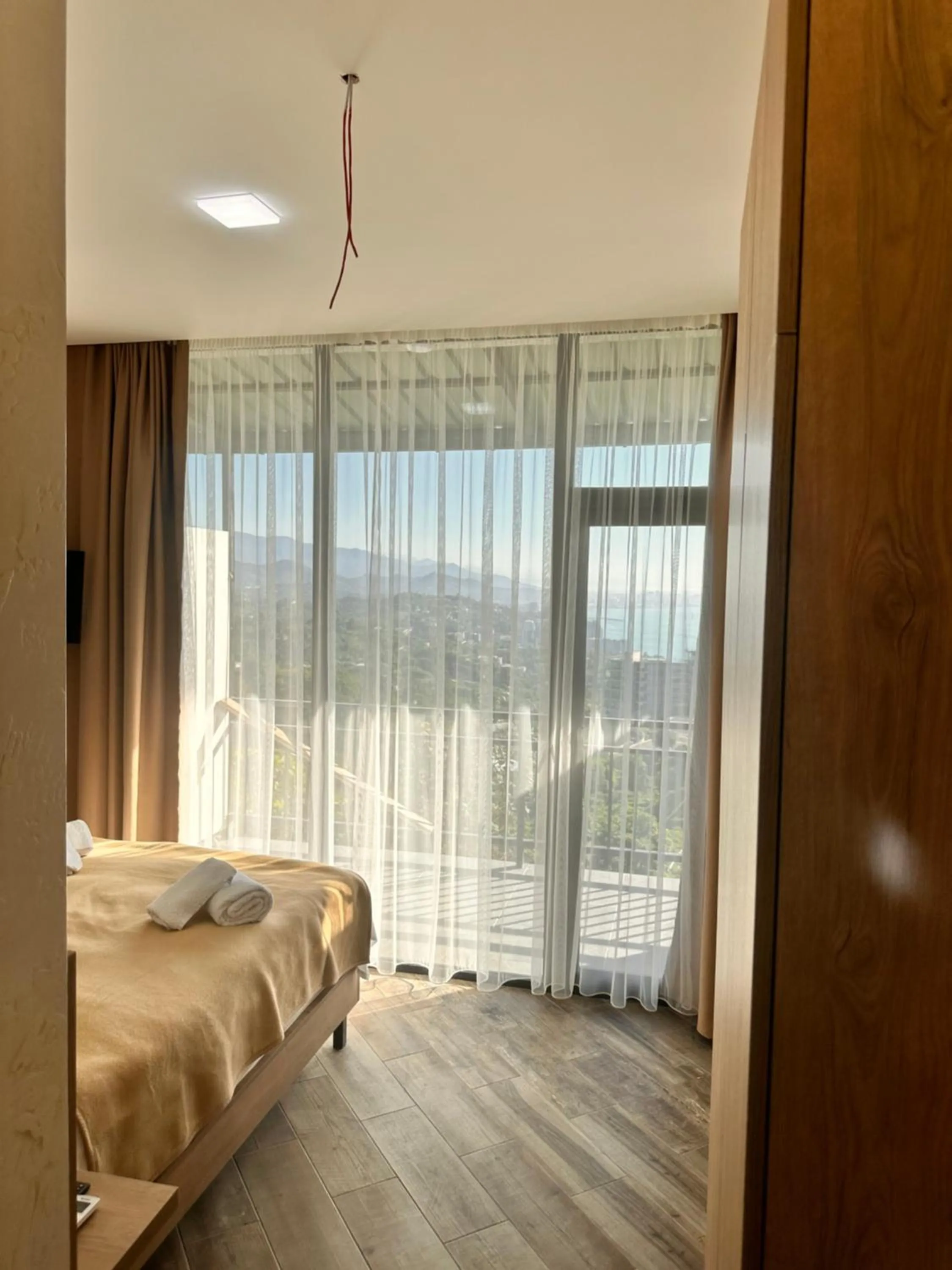 Photo of the whole room, Bed in Green Cape Tower