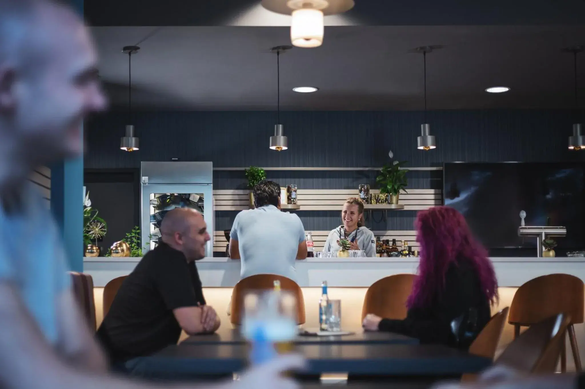 Lounge or bar in Holiday Inn - the niu, Brass Munich Olympiapark by IHG Lounge or bar in Holiday Inn - the niu, Brass Munich Olympiapark by IHG