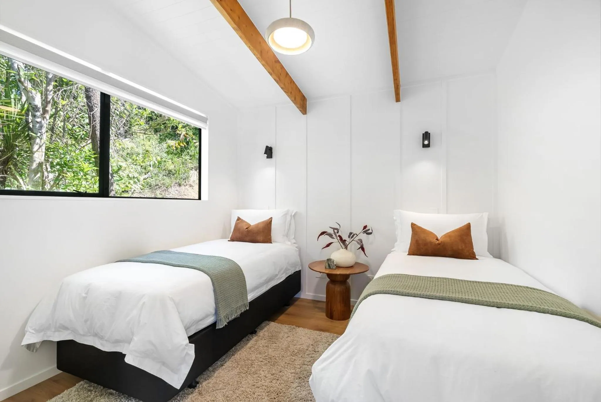 Bed in Tui & Nikau Cabins