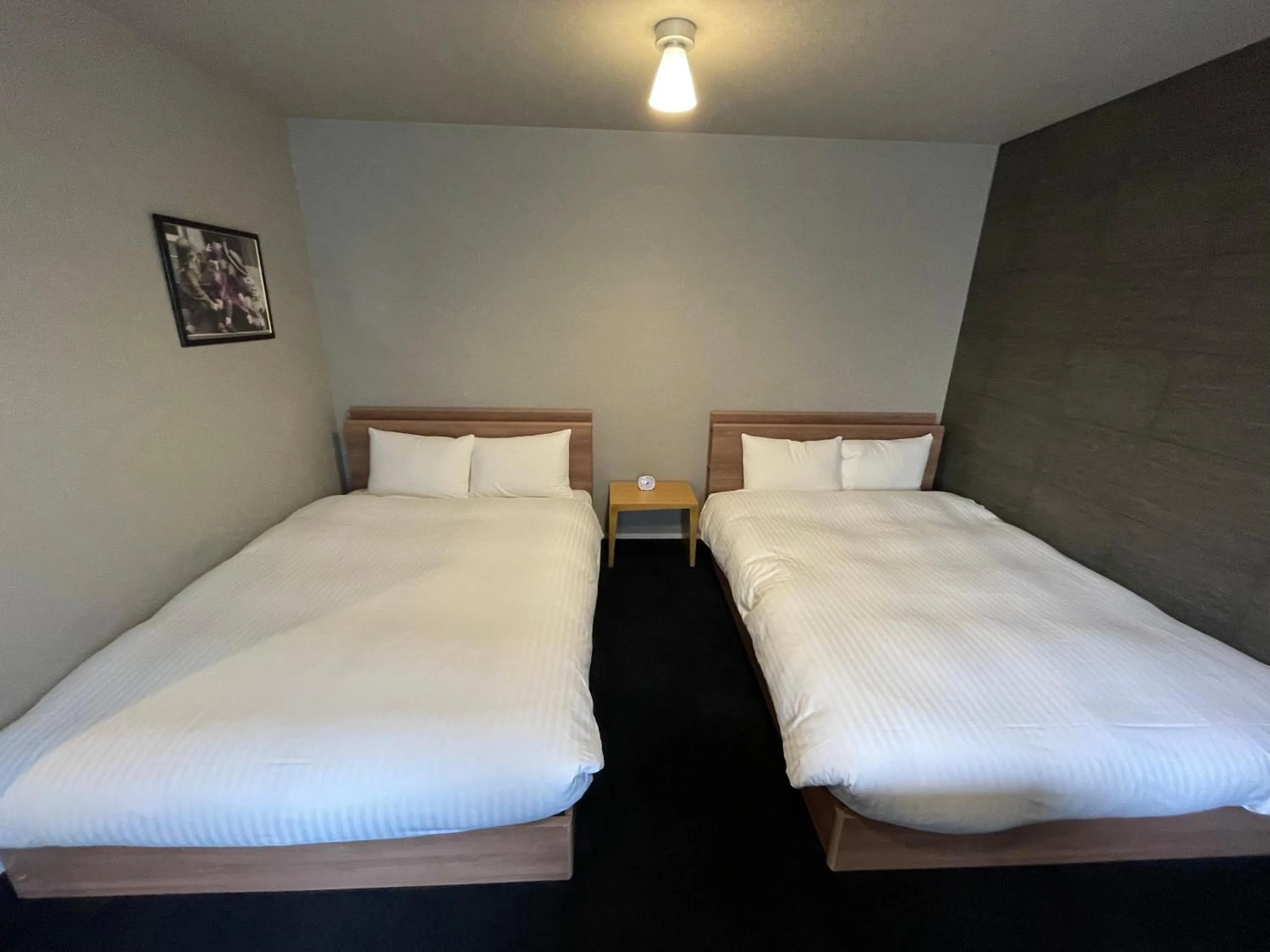 Bed in The Grand Residence Hotel Tenjin