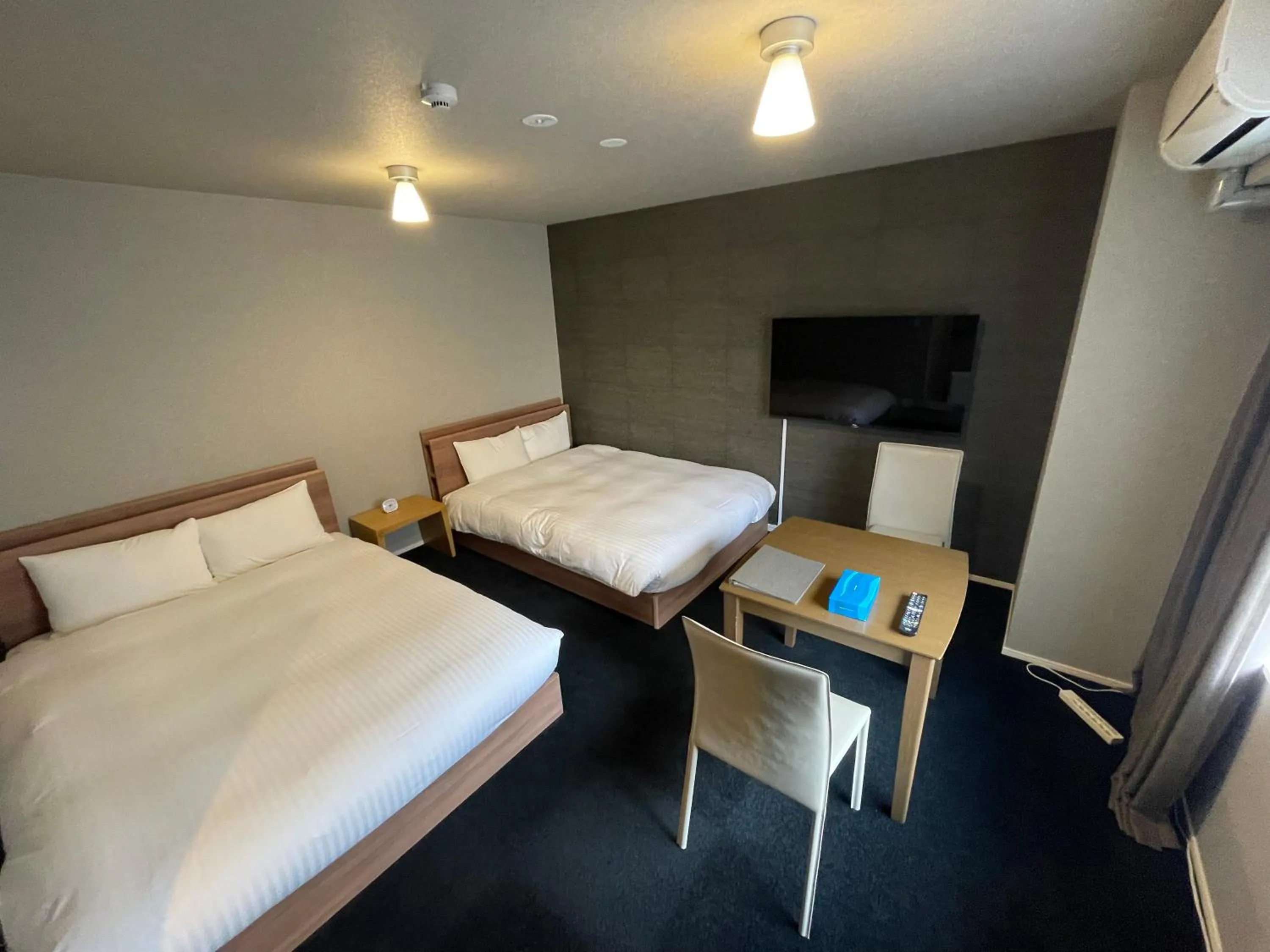 Bed in The Grand Residence Hotel Tenjin