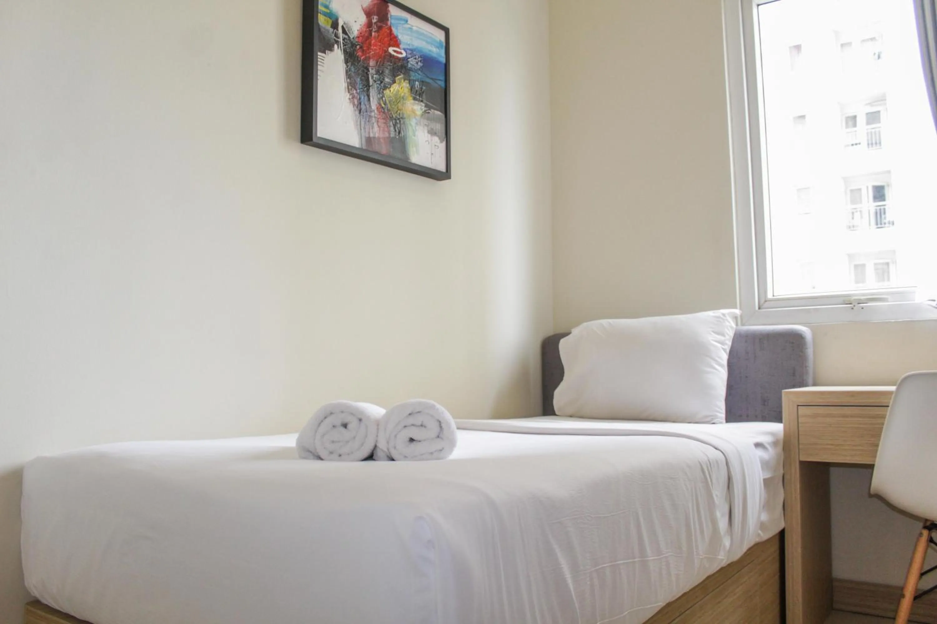 Bed in Homey 2BR Apartment at Grand Palace Kemayoran By Travelio