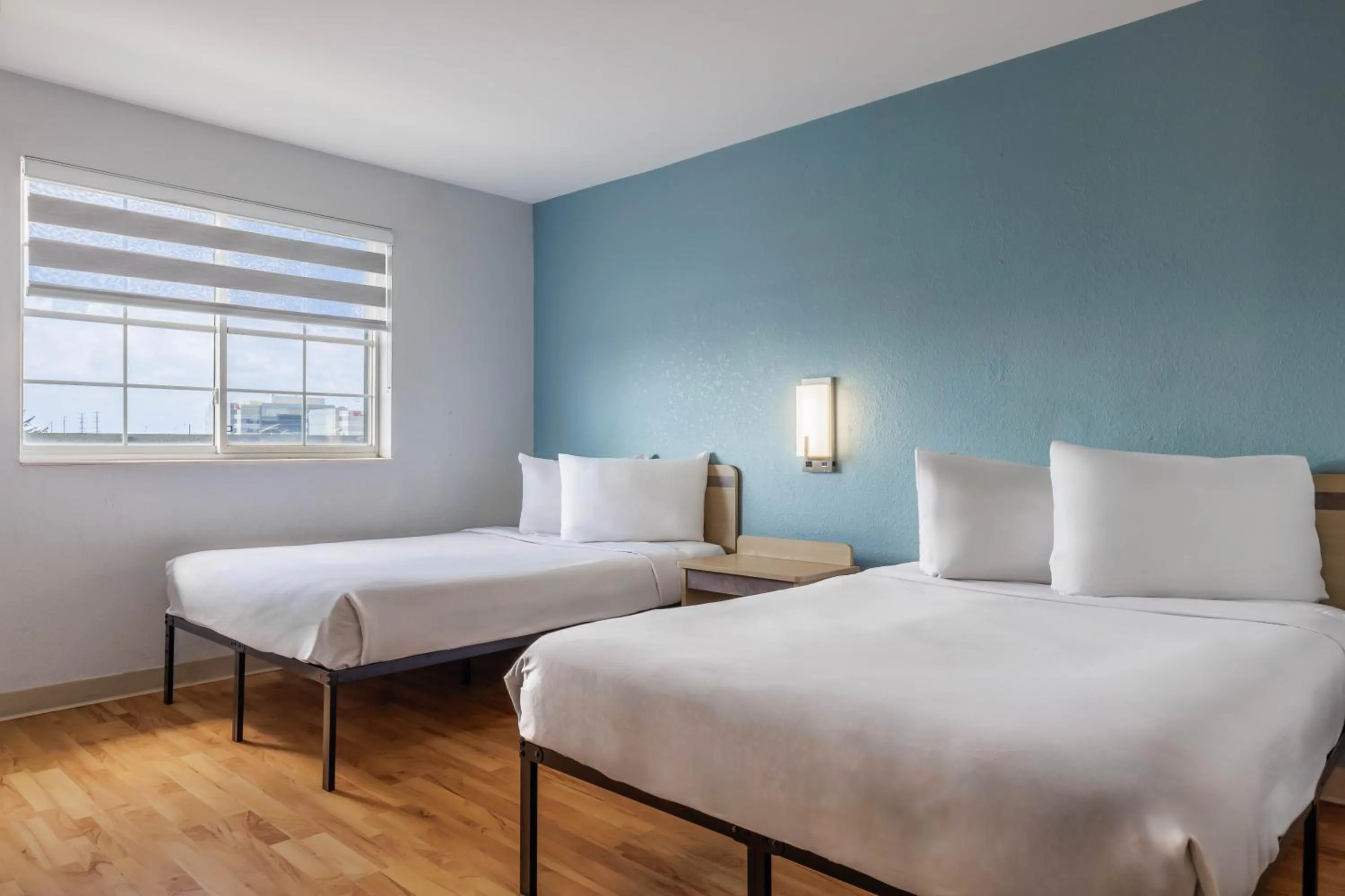 Bed in Studio 6 Toronto - Mississauga with Kitchenettes