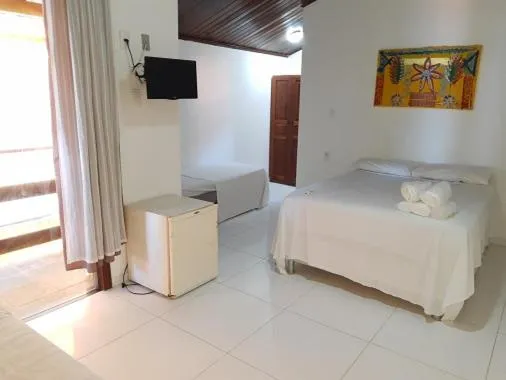 Bed in Pousada Grauçá