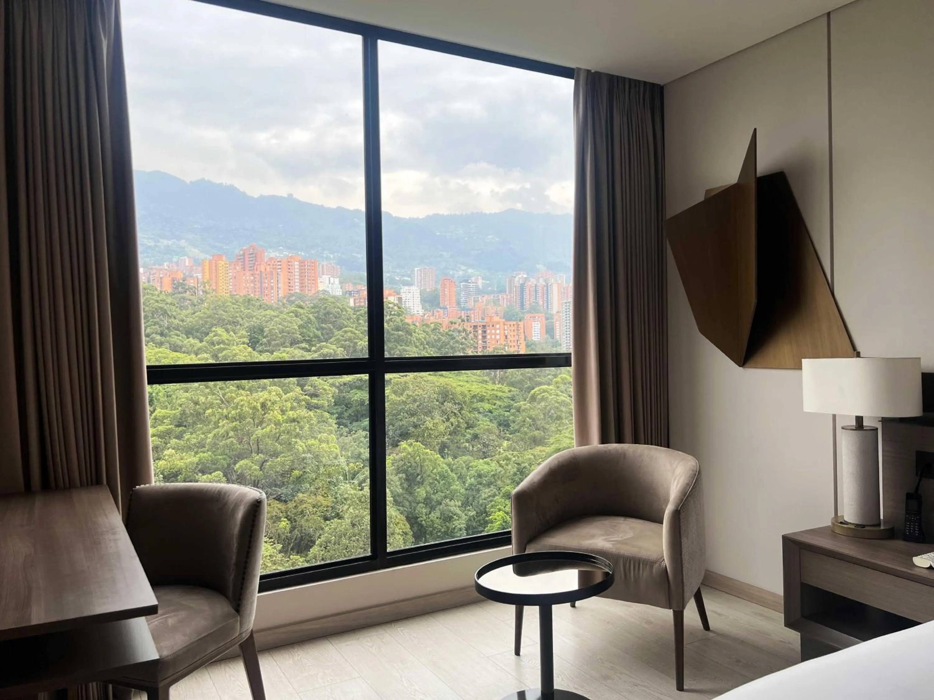 Living room in York Medellin, Curio Collection by Hilton