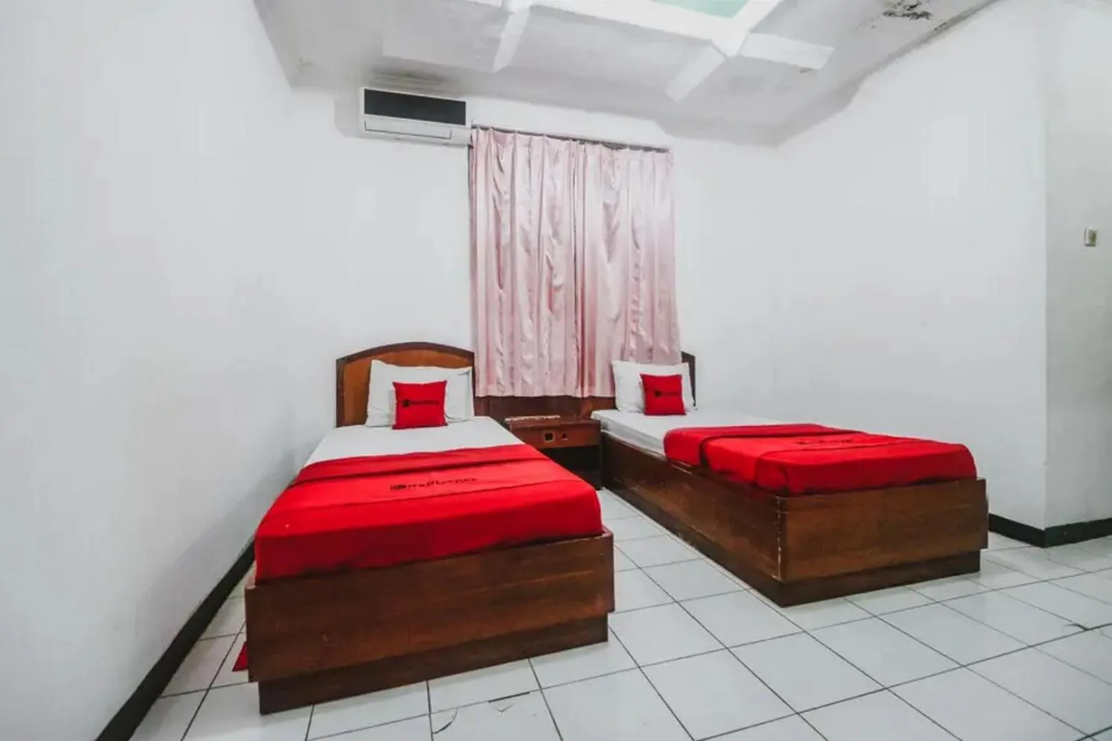 Bedroom, Bed in RedDoorz Plus at Neo Asri Hotel Megamendung Puncak Bogor
