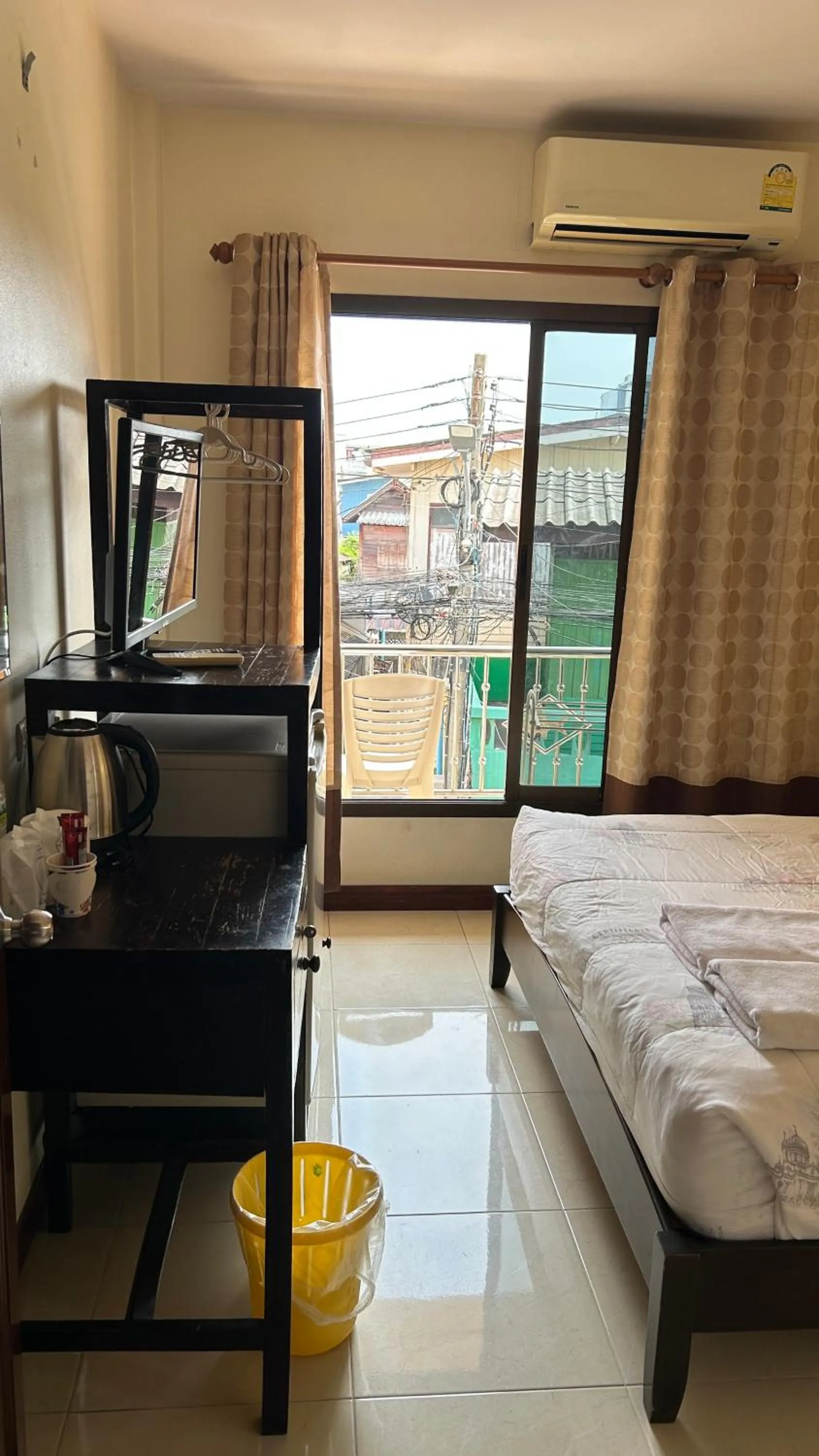 Bed in Baan Taweesuk Guest House