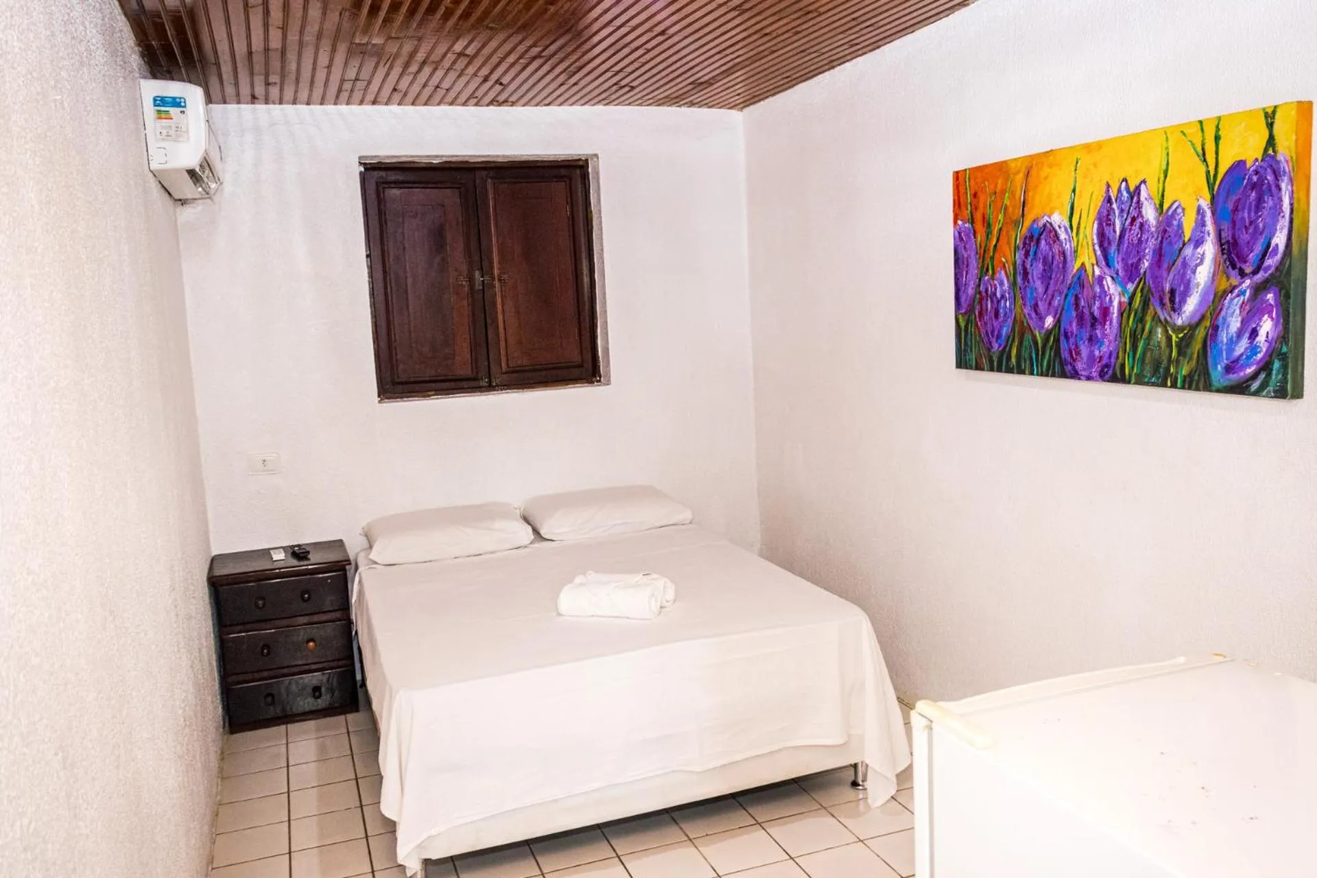 Bed in Pousada Bon Vivant