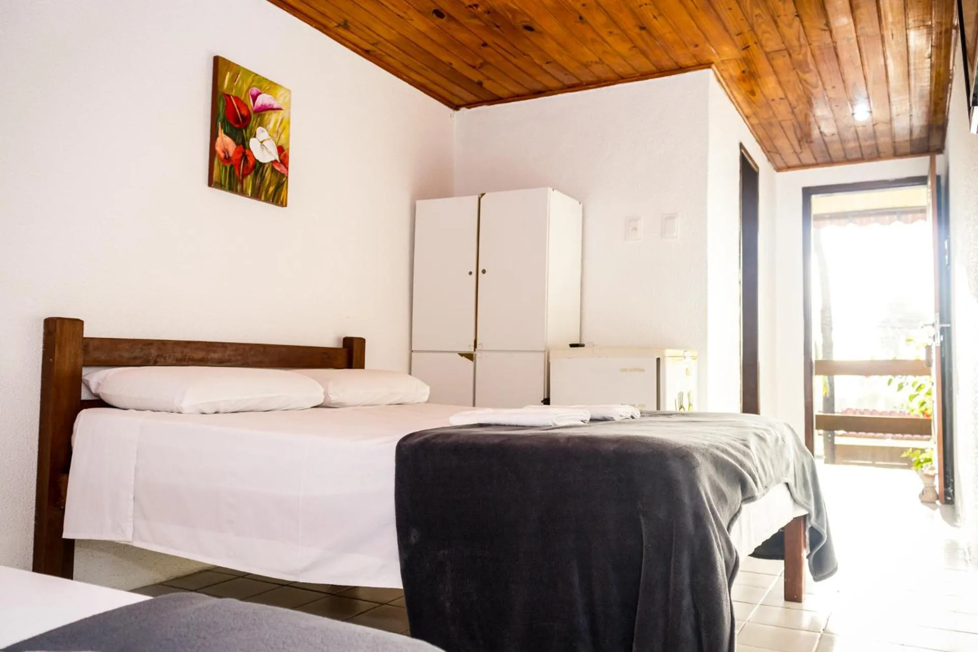 Bed in Pousada Bon Vivant