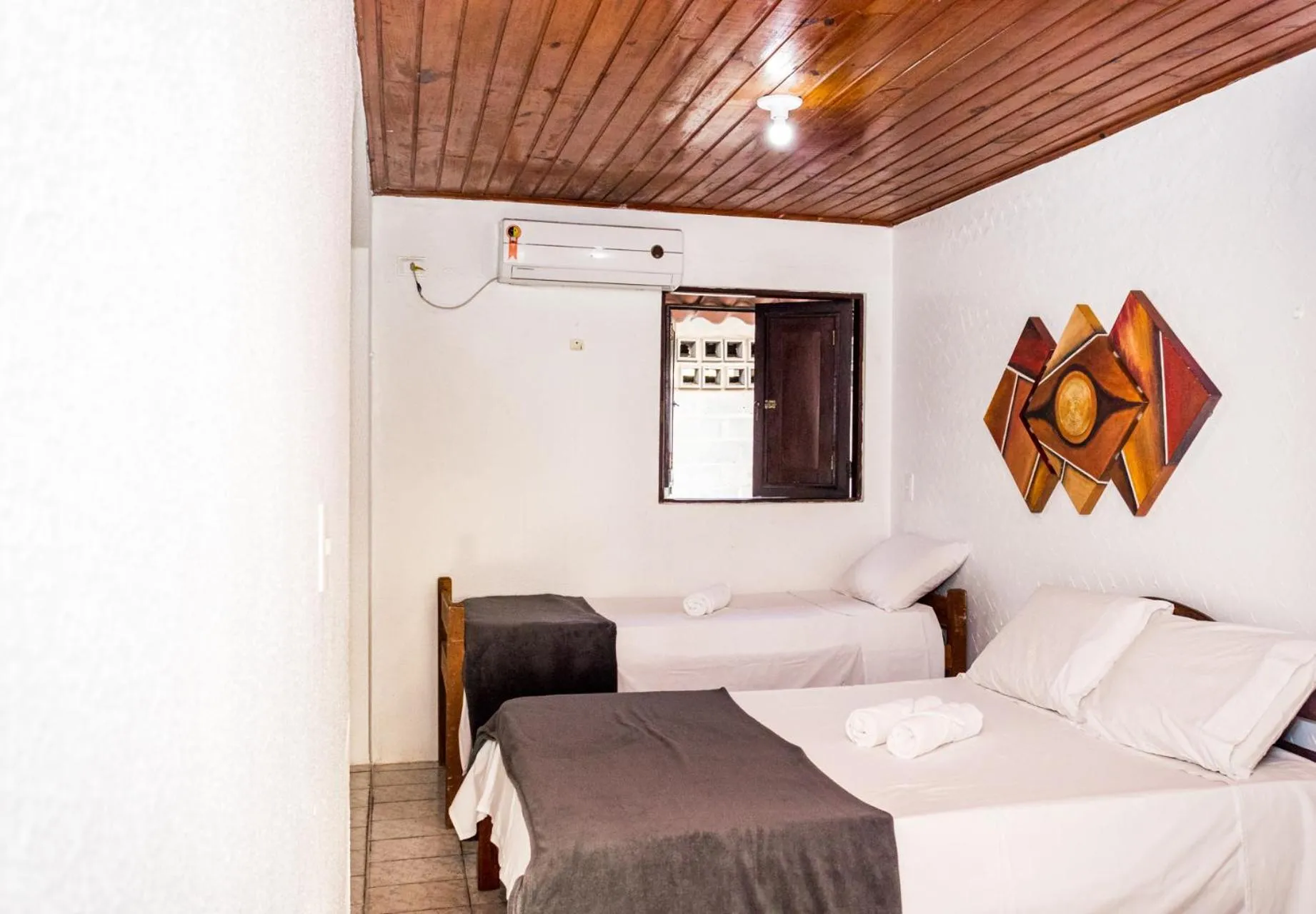 Bed in Pousada Bon Vivant