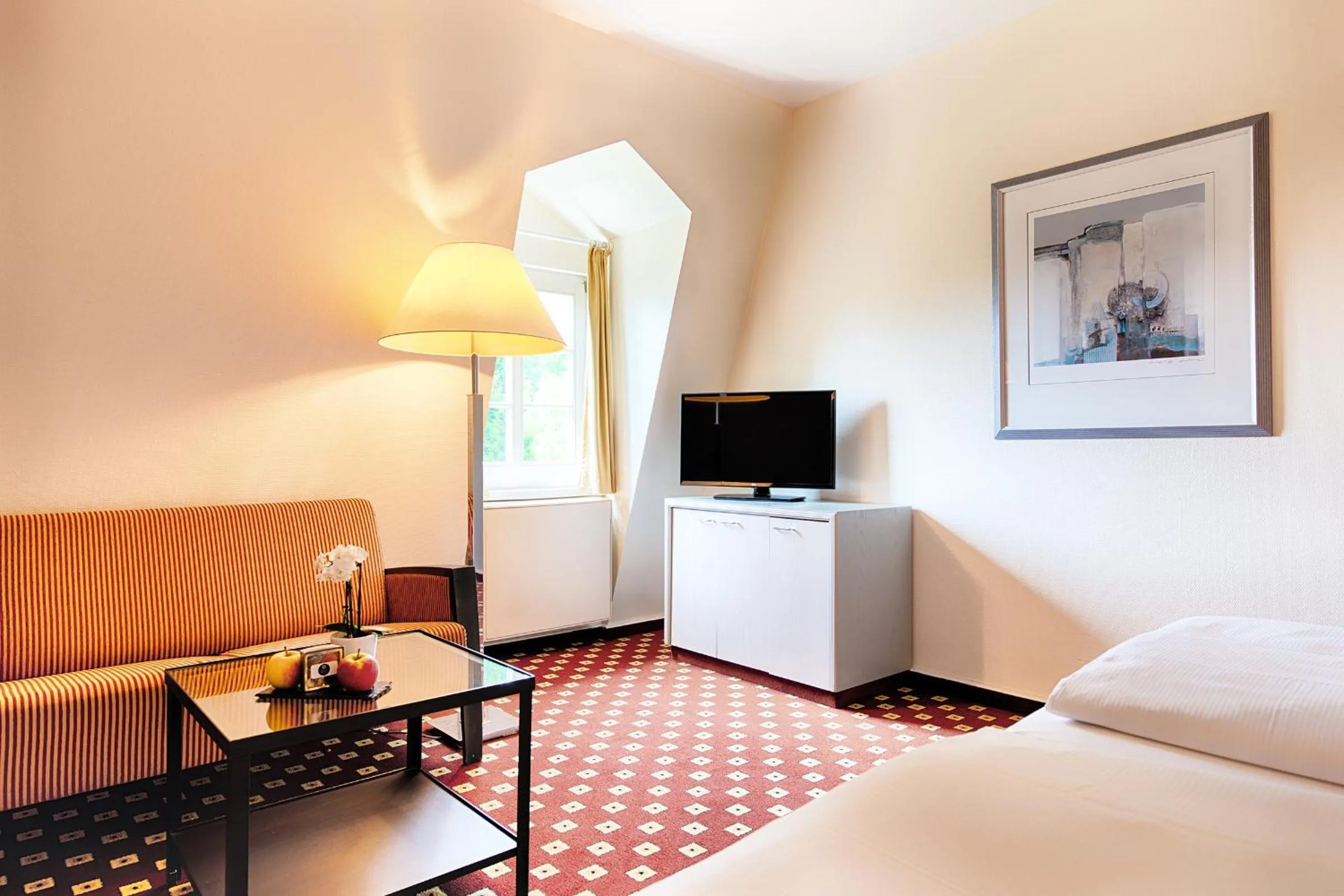 Seating area, Bed in Welcome Hotel Bad Arolsen