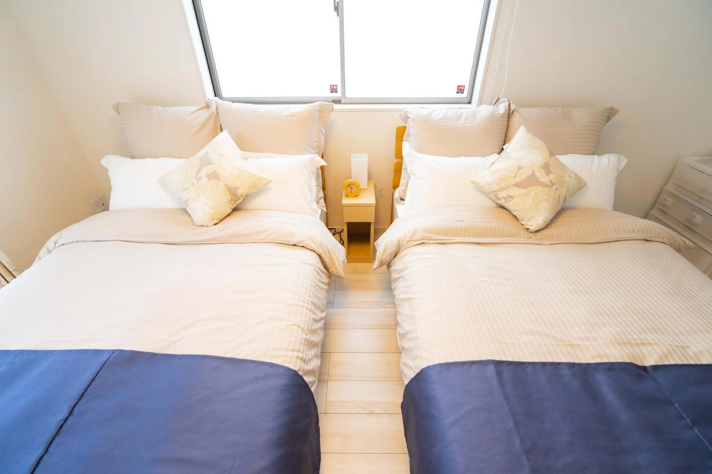 Photo of the whole room, Bed in OKINAWA BEACH HOUSE Golden Drop S