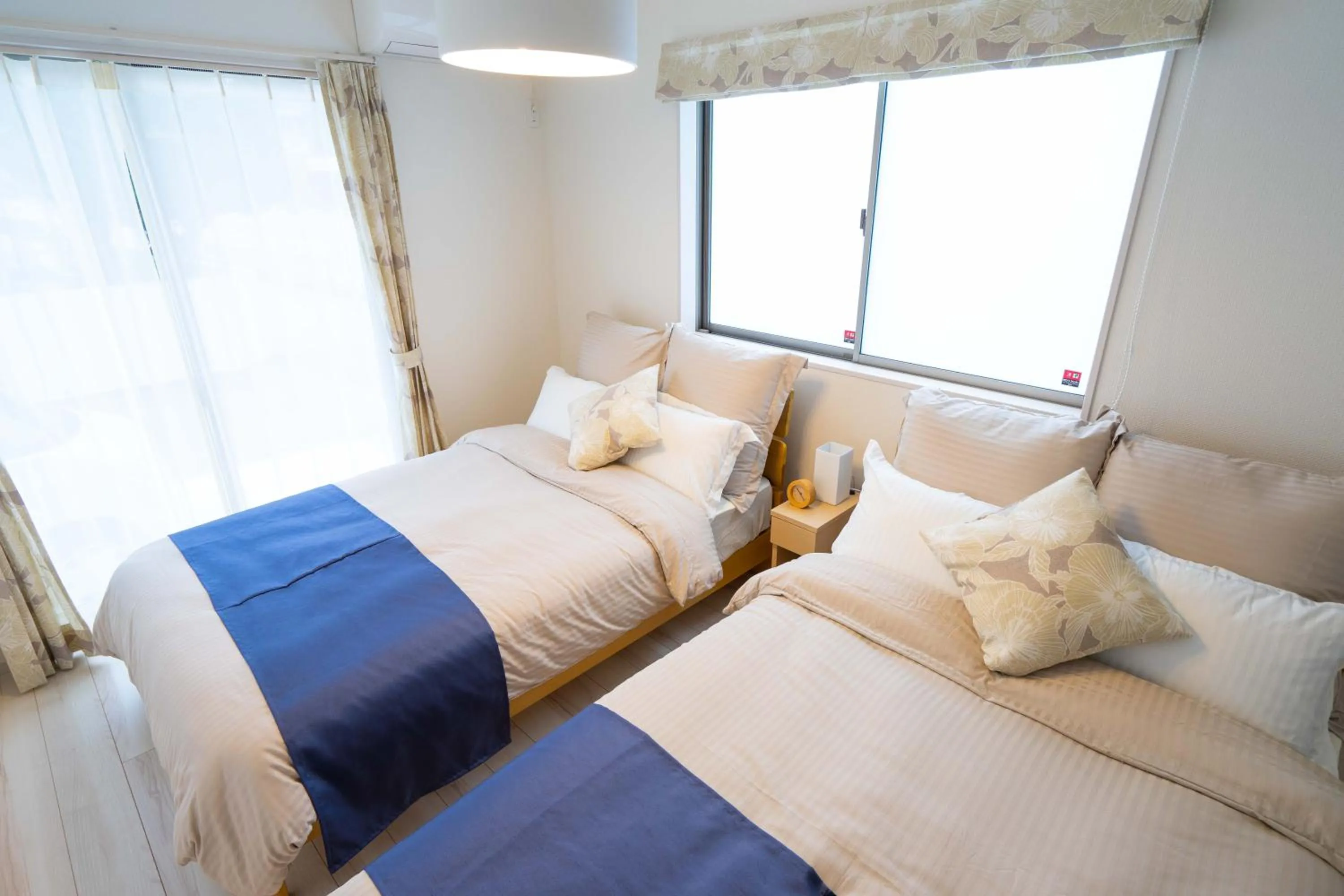 Photo of the whole room, Bed in OKINAWA BEACH HOUSE Golden Drop S