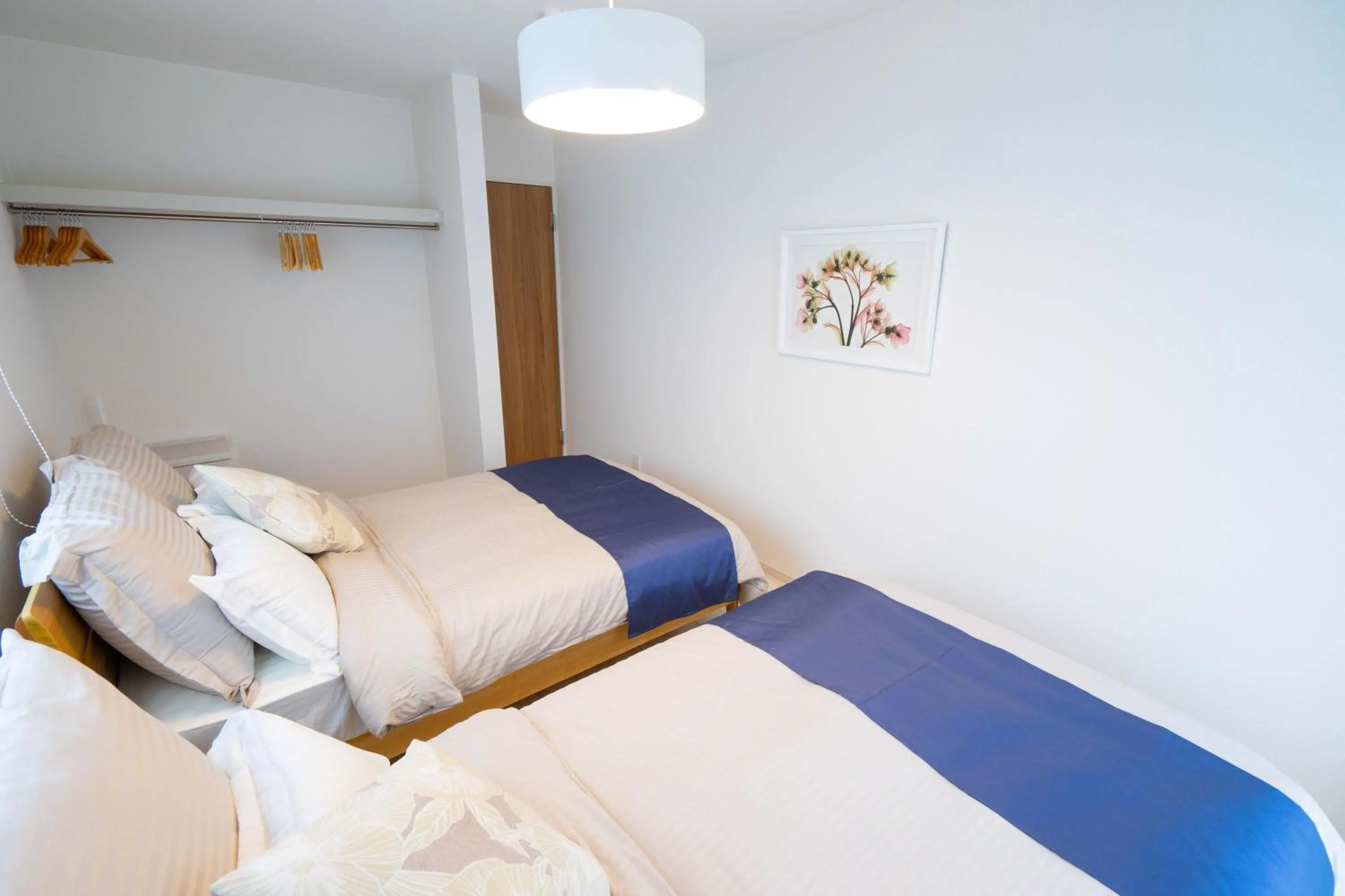 Photo of the whole room, Bed in OKINAWA BEACH HOUSE Golden Drop S