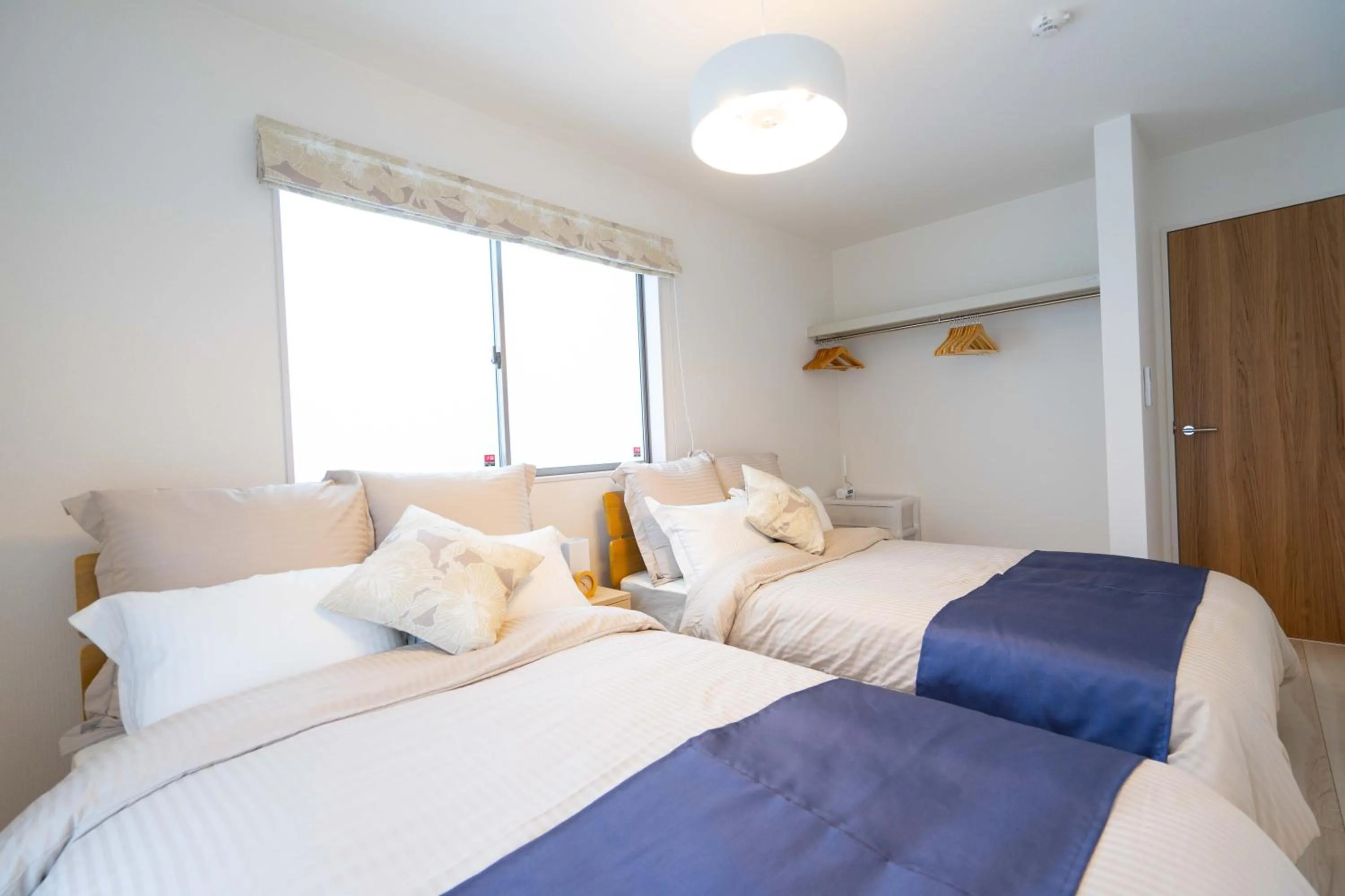 Photo of the whole room, Bed in OKINAWA BEACH HOUSE Golden Drop S