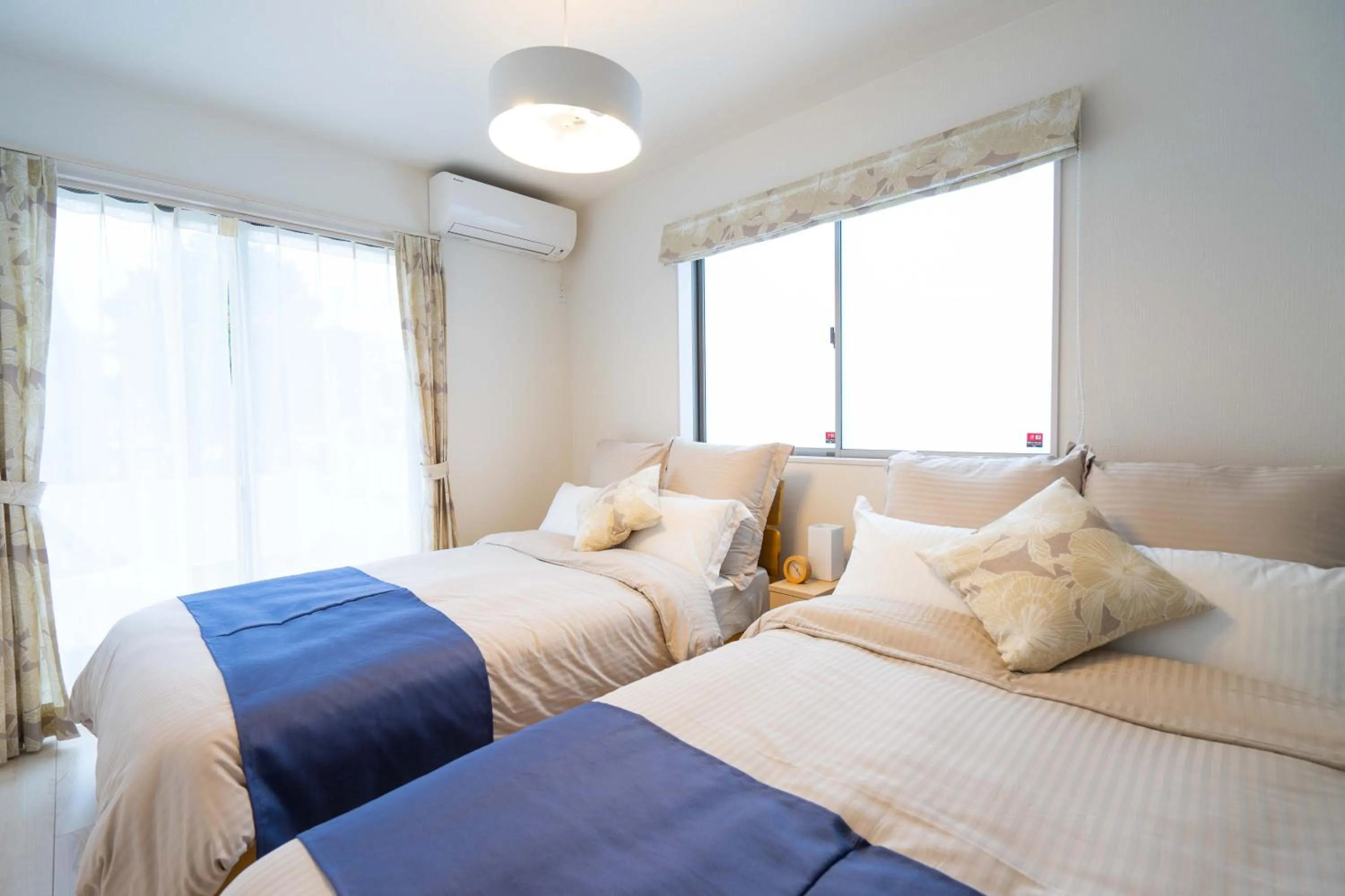 Photo of the whole room, Bed in OKINAWA BEACH HOUSE Golden Drop S