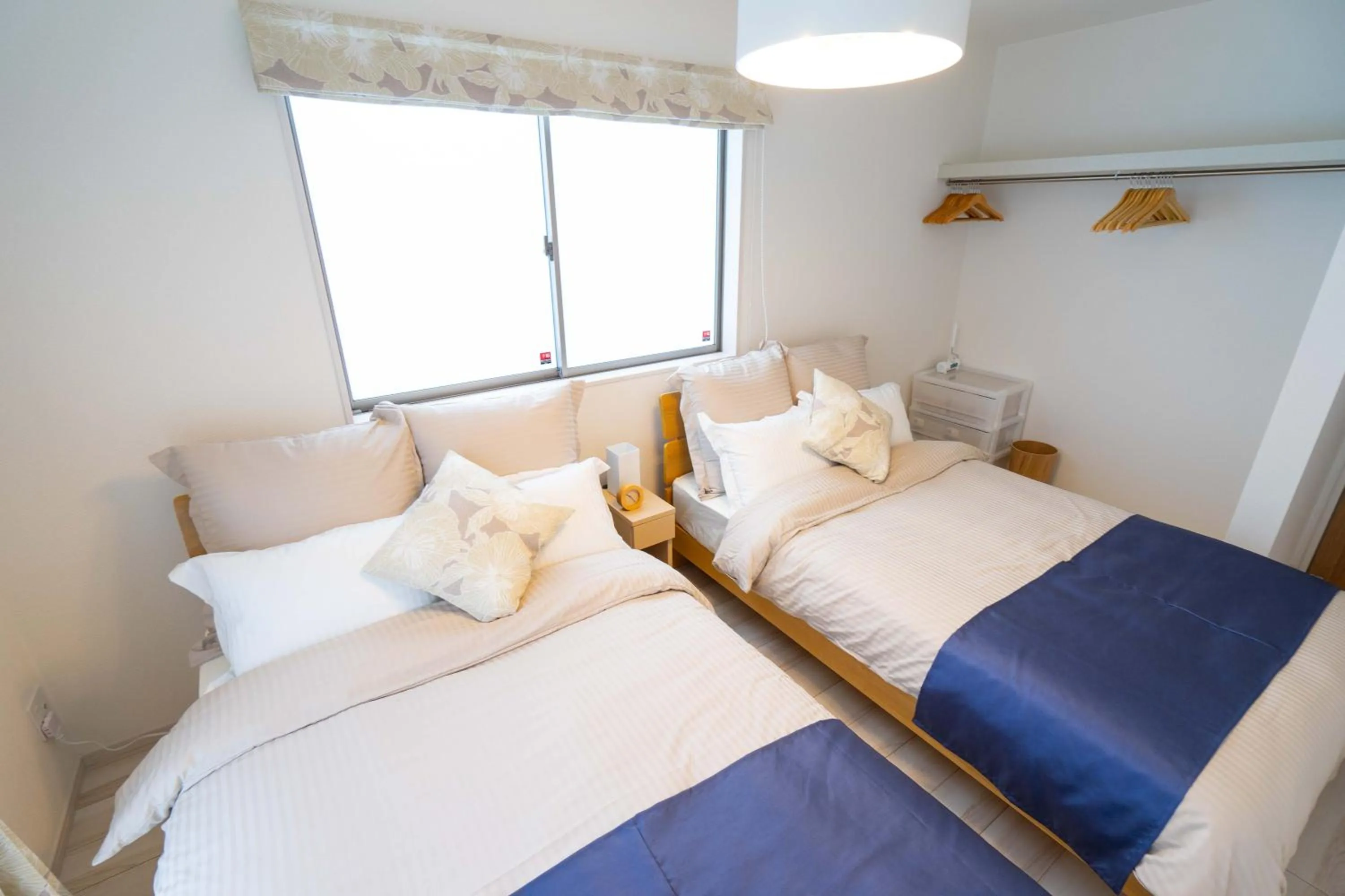 Photo of the whole room, Bed in OKINAWA BEACH HOUSE Golden Drop S