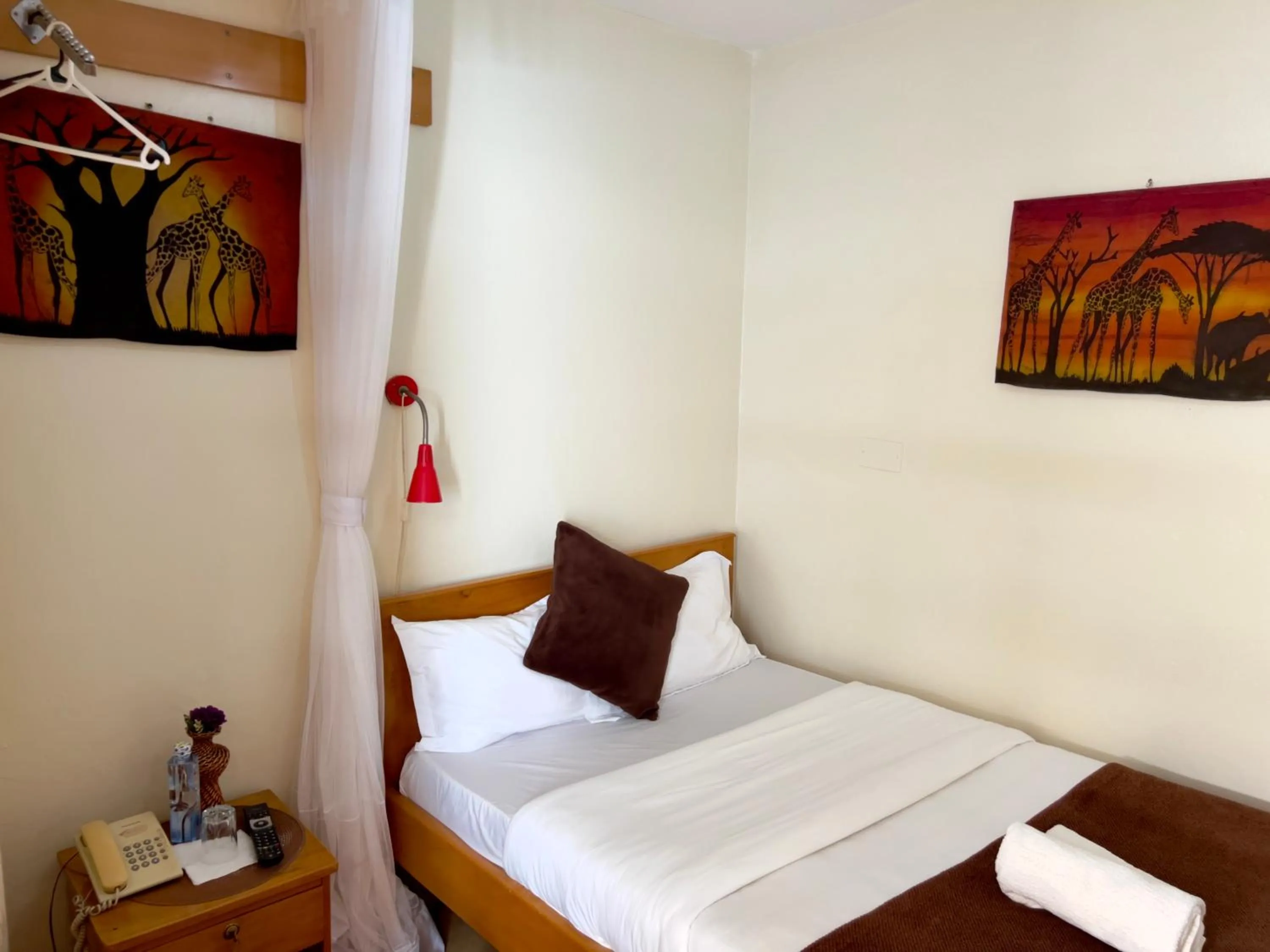 Bedroom, Bed in Sunset Hotel Entebbe