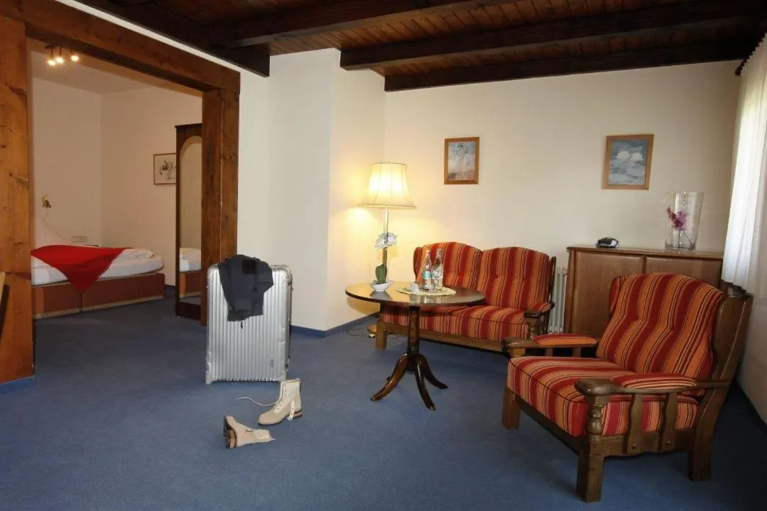 Living room, Bed in Hotel Faller