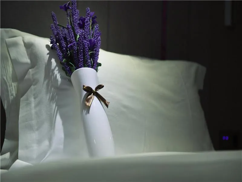 Bed in Lavande Hotel Guiyang Flower Orchard Fortune Plaza