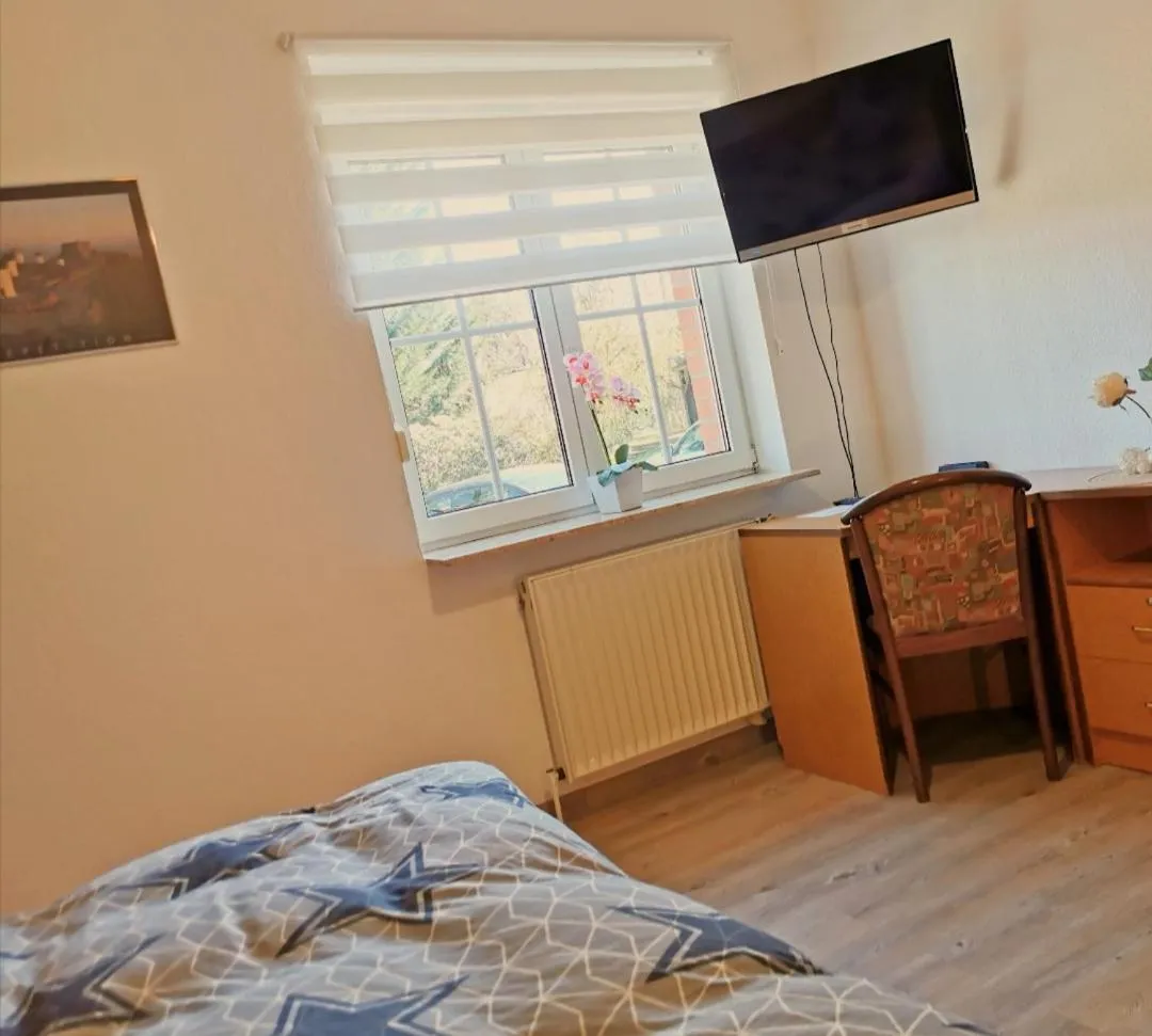 Seating area, Bed in Landhotel Heidkrug