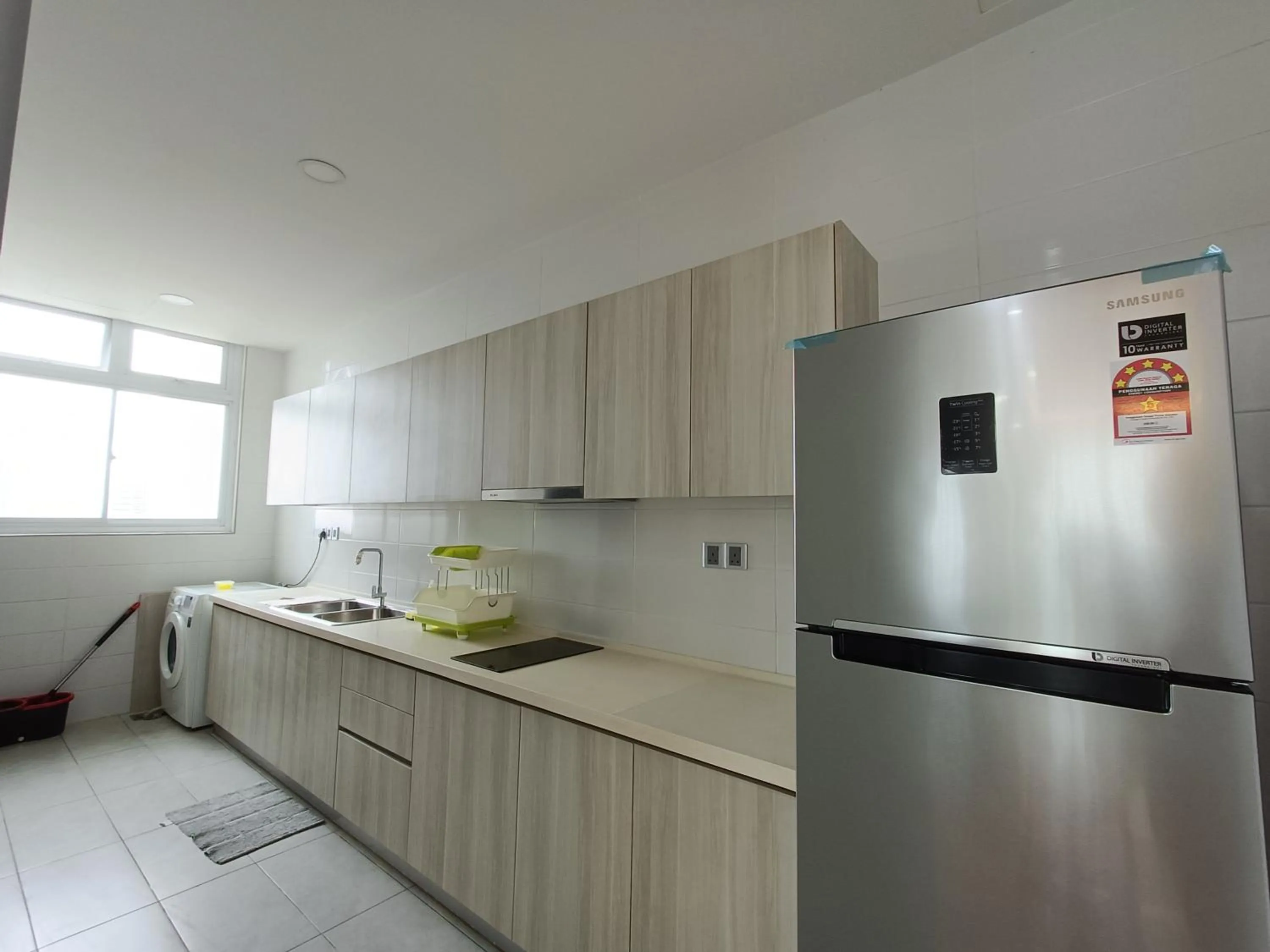 Kitchen or kitchenette in Paragon Suite Homestay by Antlerzone