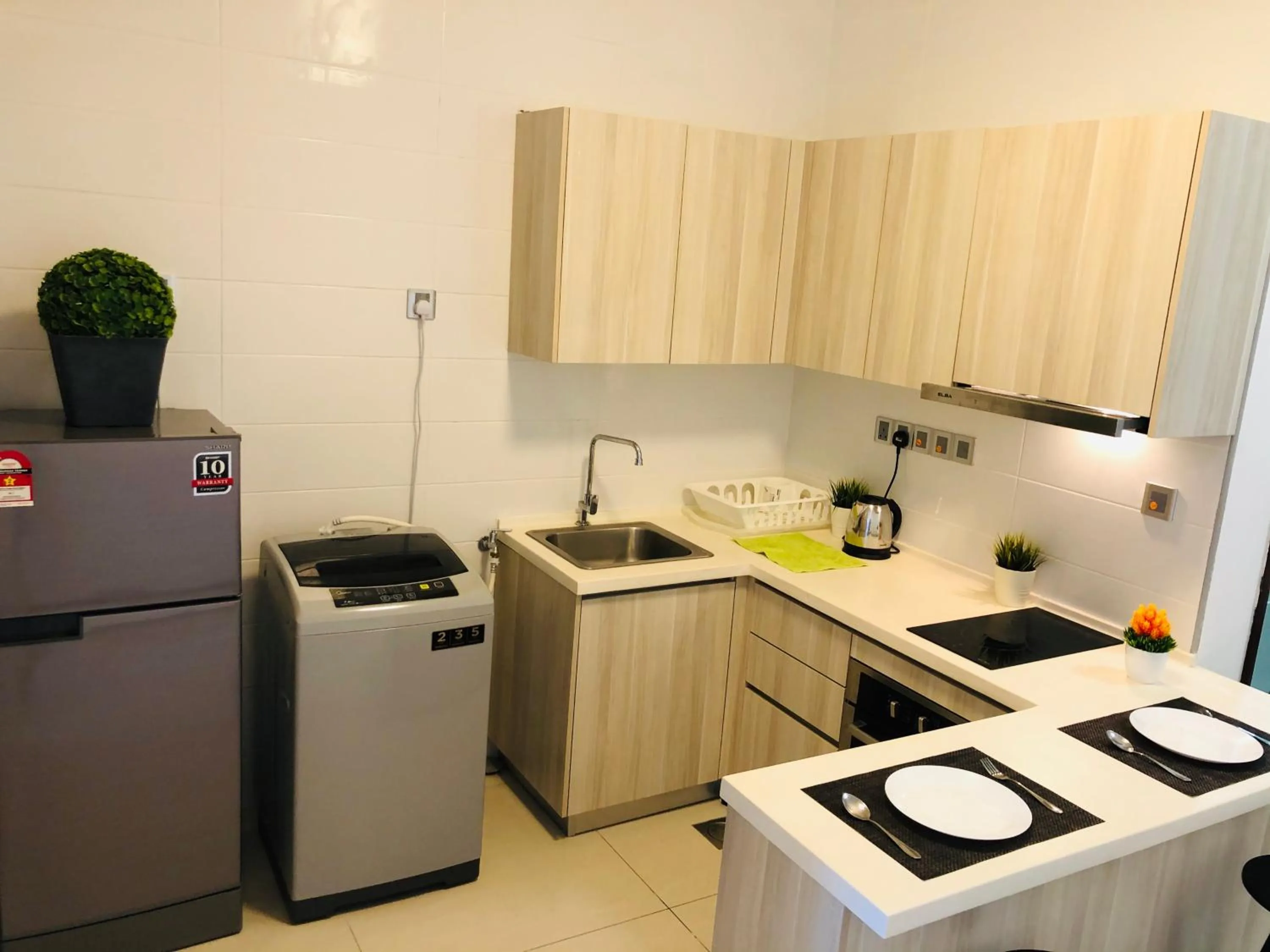 Kitchen or kitchenette in Paragon Suite Homestay by Antlerzone