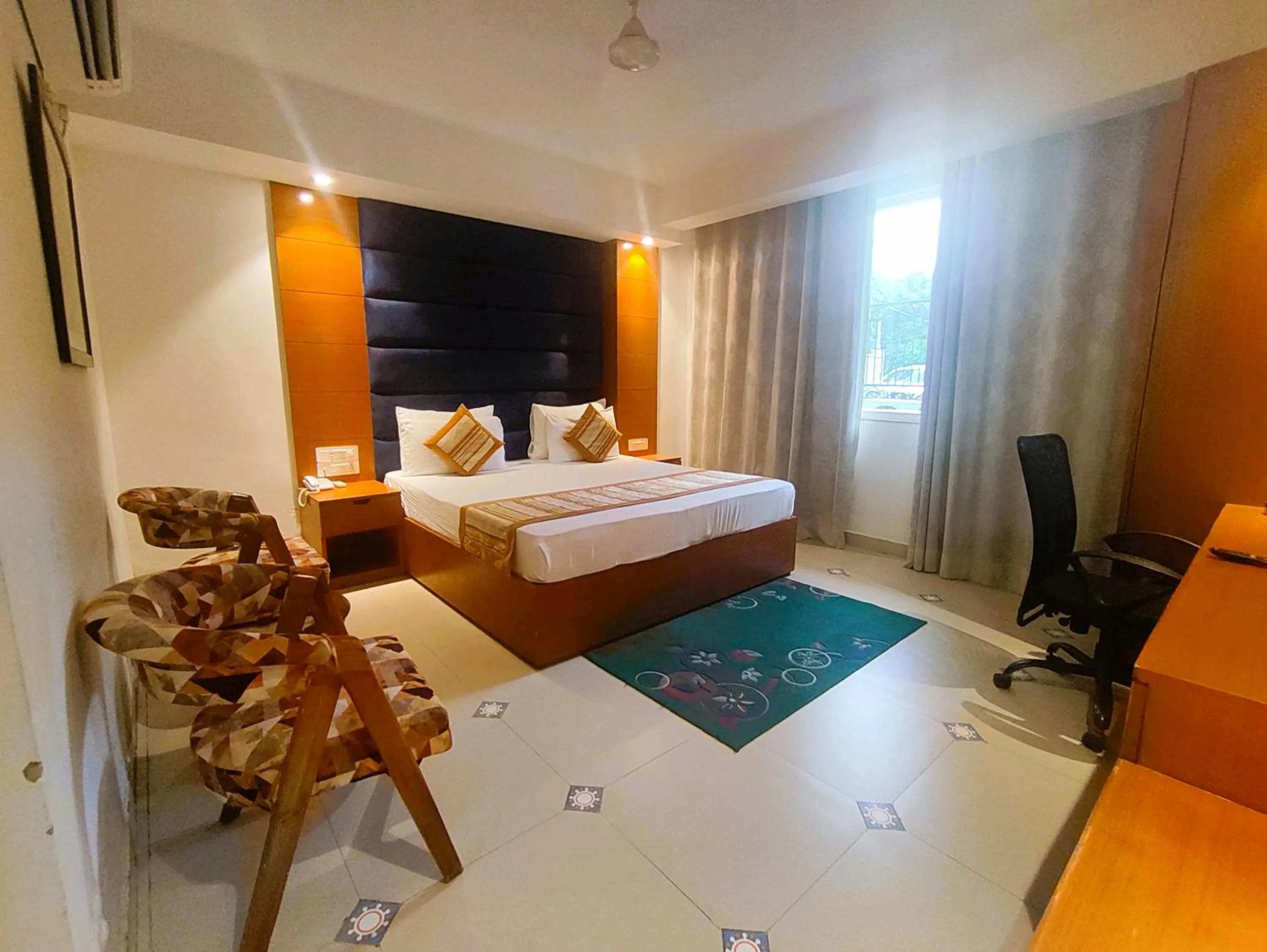 Photo of the whole room, Bed in The Angel Hotel & Suites near Medanta