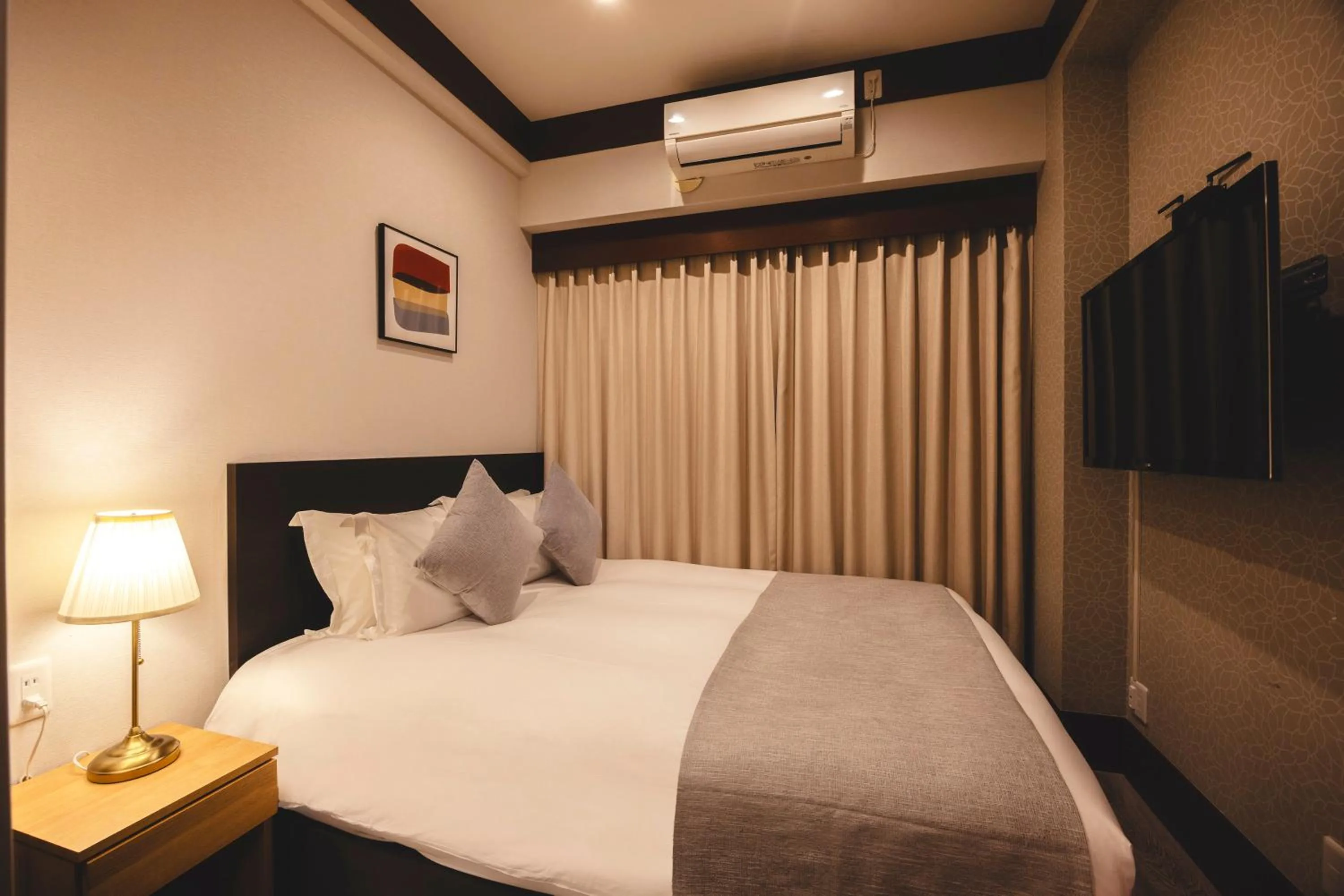 Photo of the whole room, Bed in Centurion Hotel Residential Akasaka Station