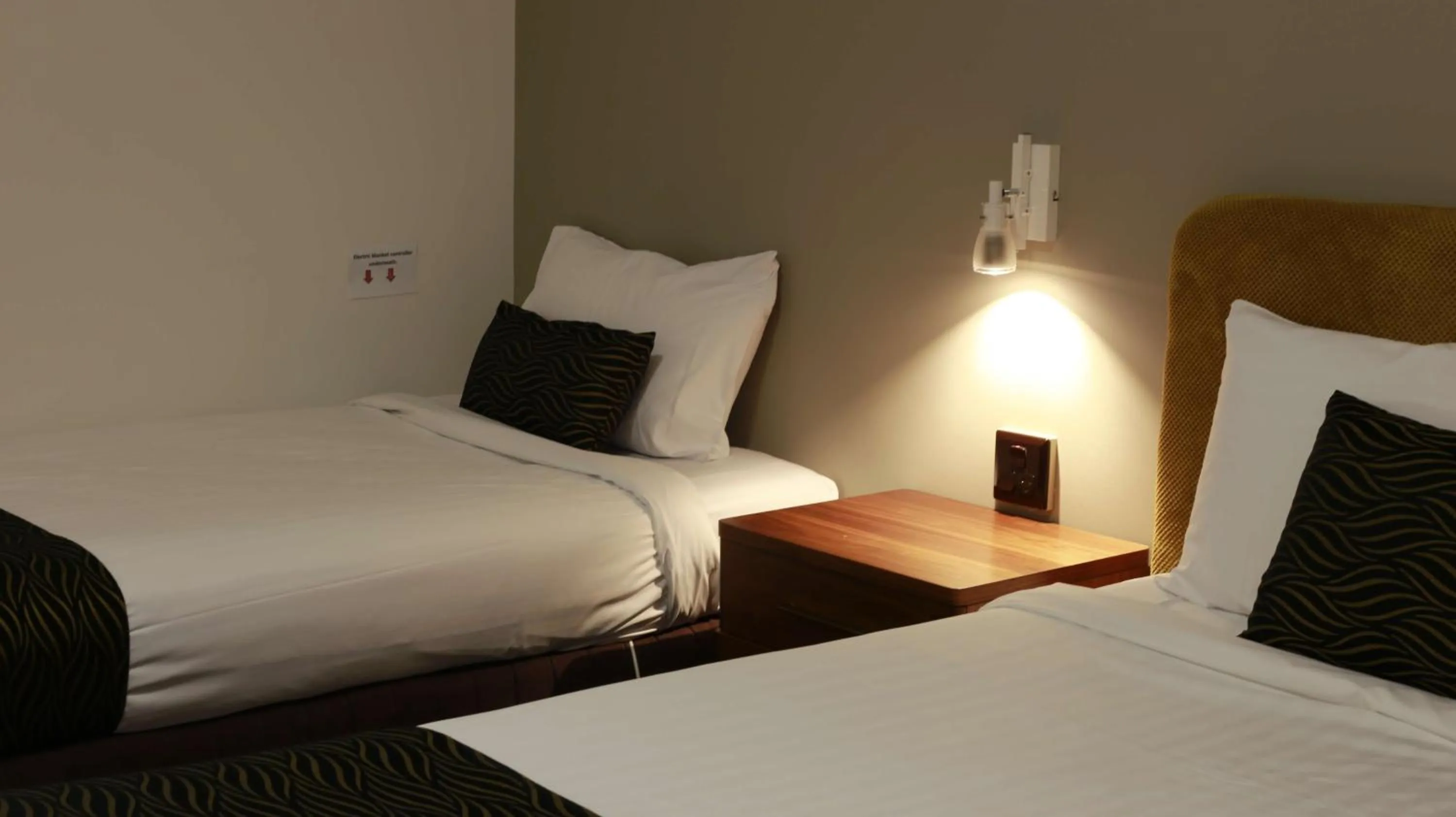 Bed in Hamilton's Queanbeyan Motel