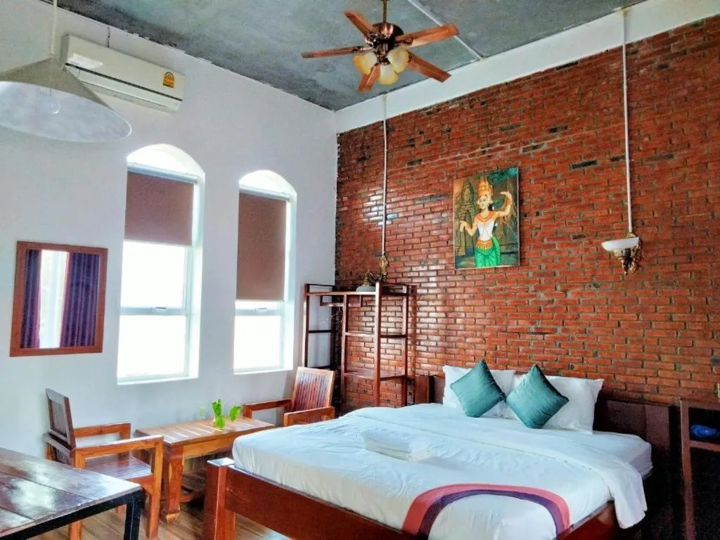 Bed in The Coconut House Hotel