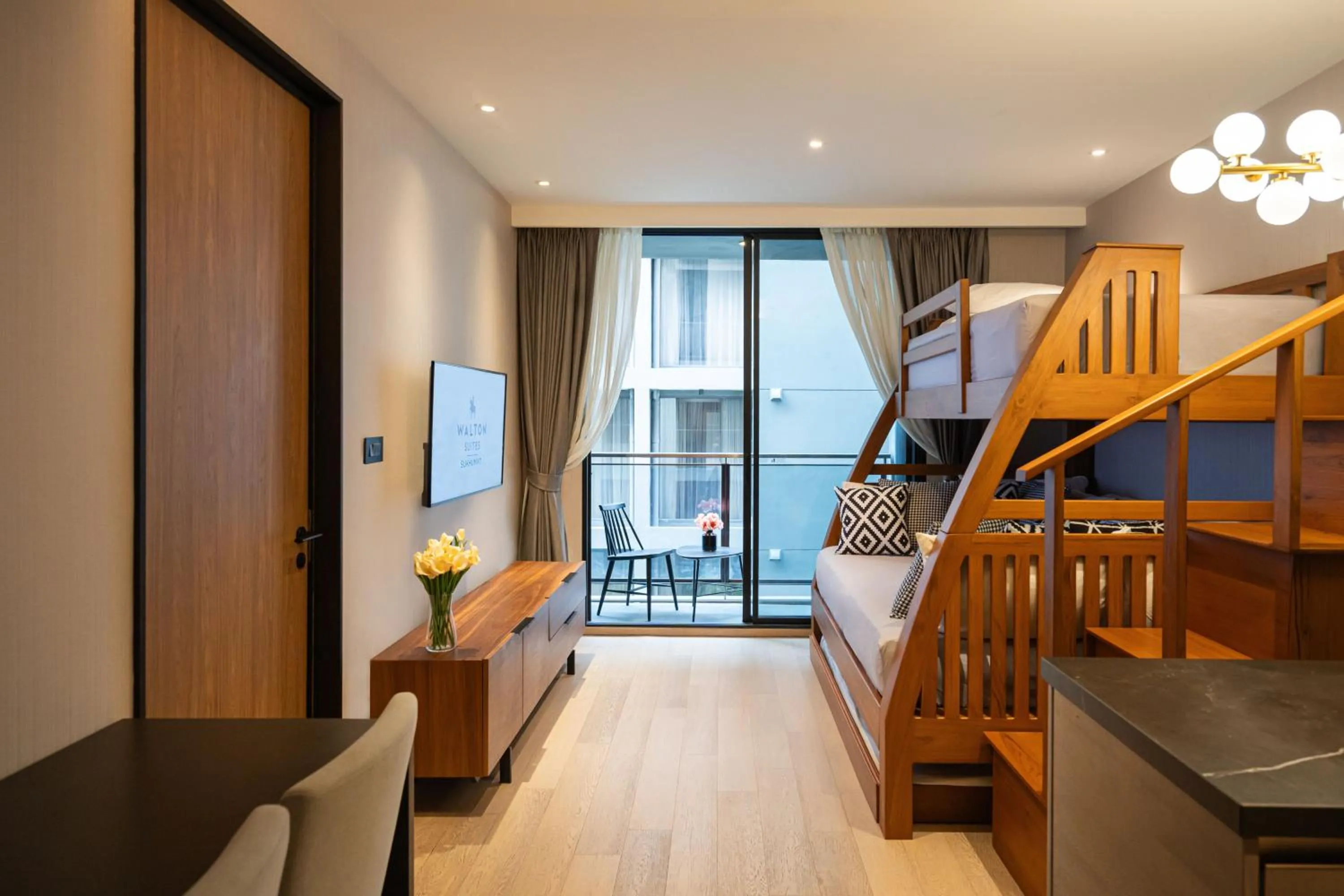 Seating area, Bed in Walton Suites Sukhumvit