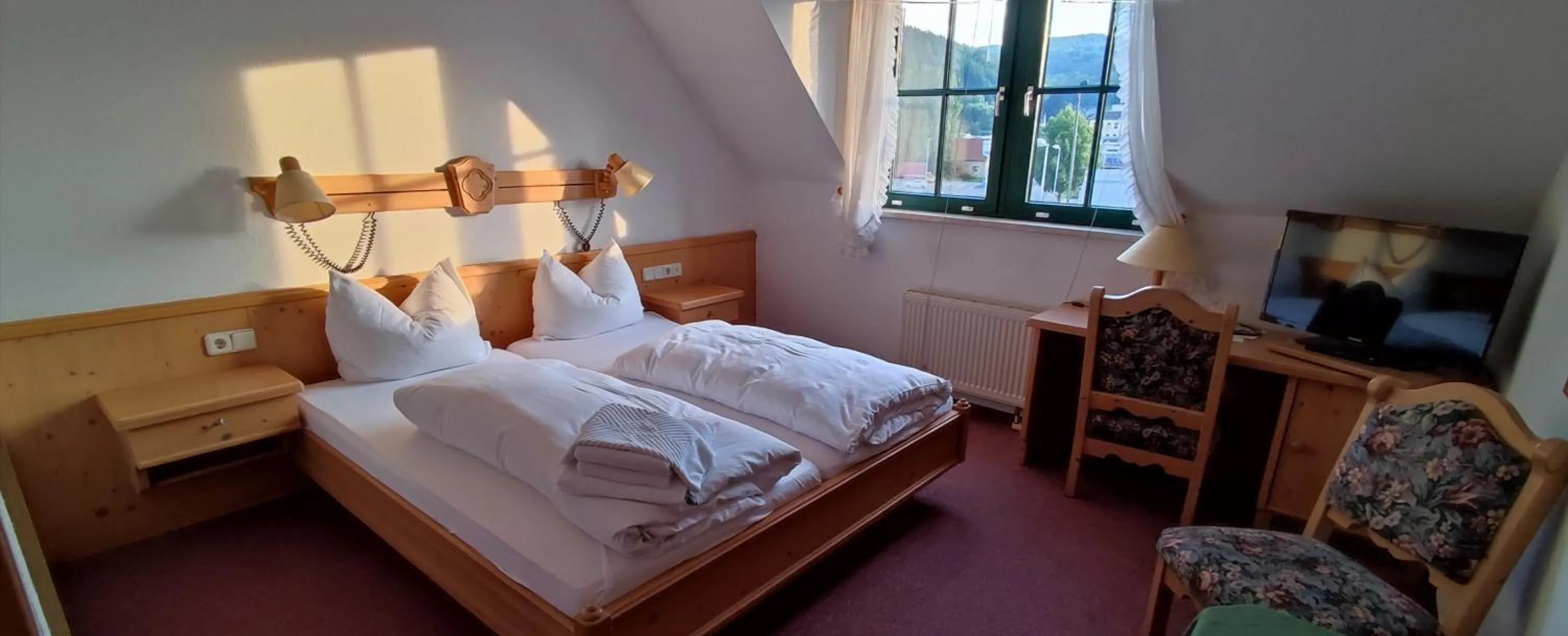 Communal lounge/ TV room in Hotel Stadt Olbernhau