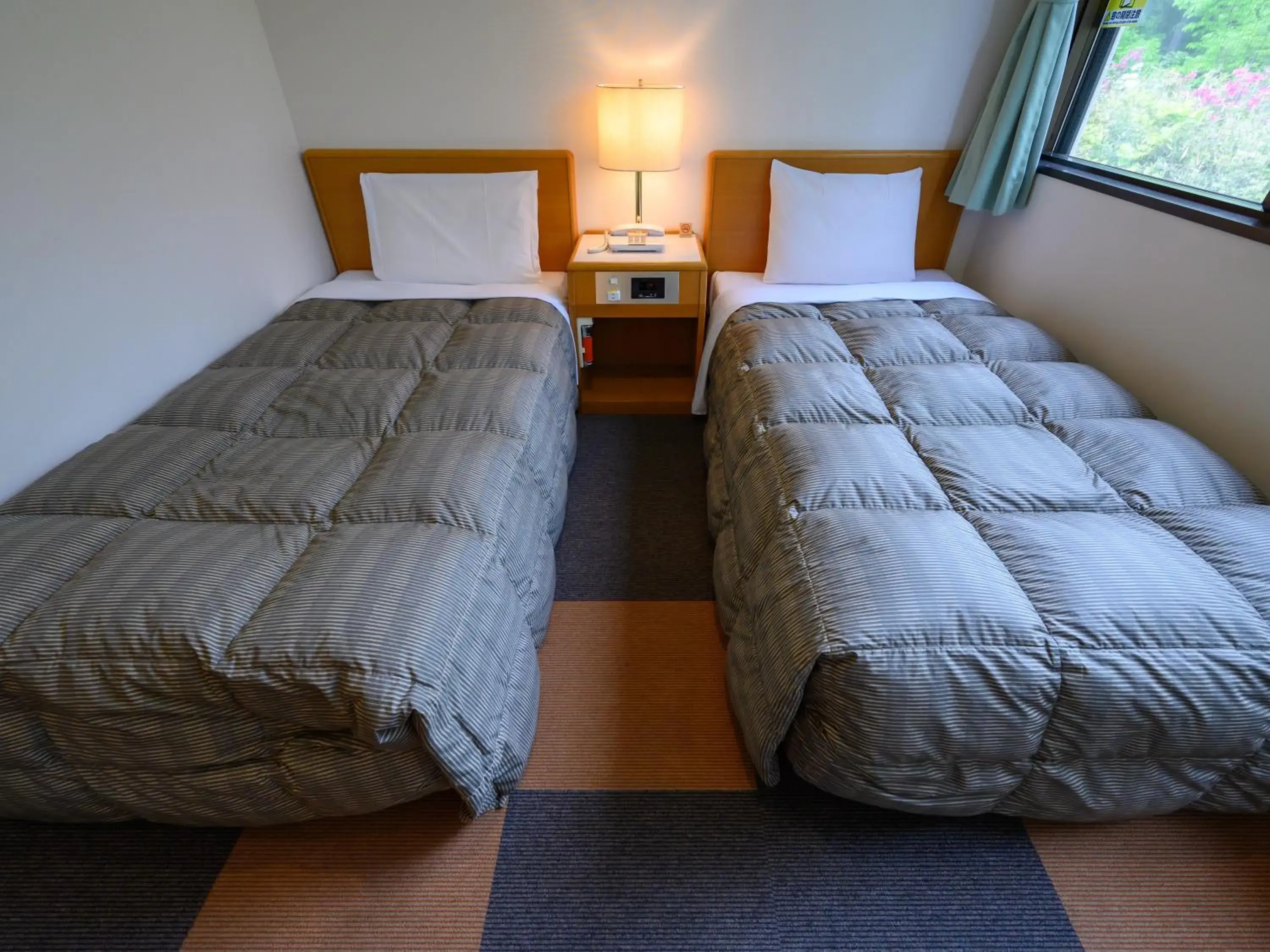 Twin Room with Private Bathroom in Rest Inn Taga Twin Room with Private Bathroom in Rest Inn Taga