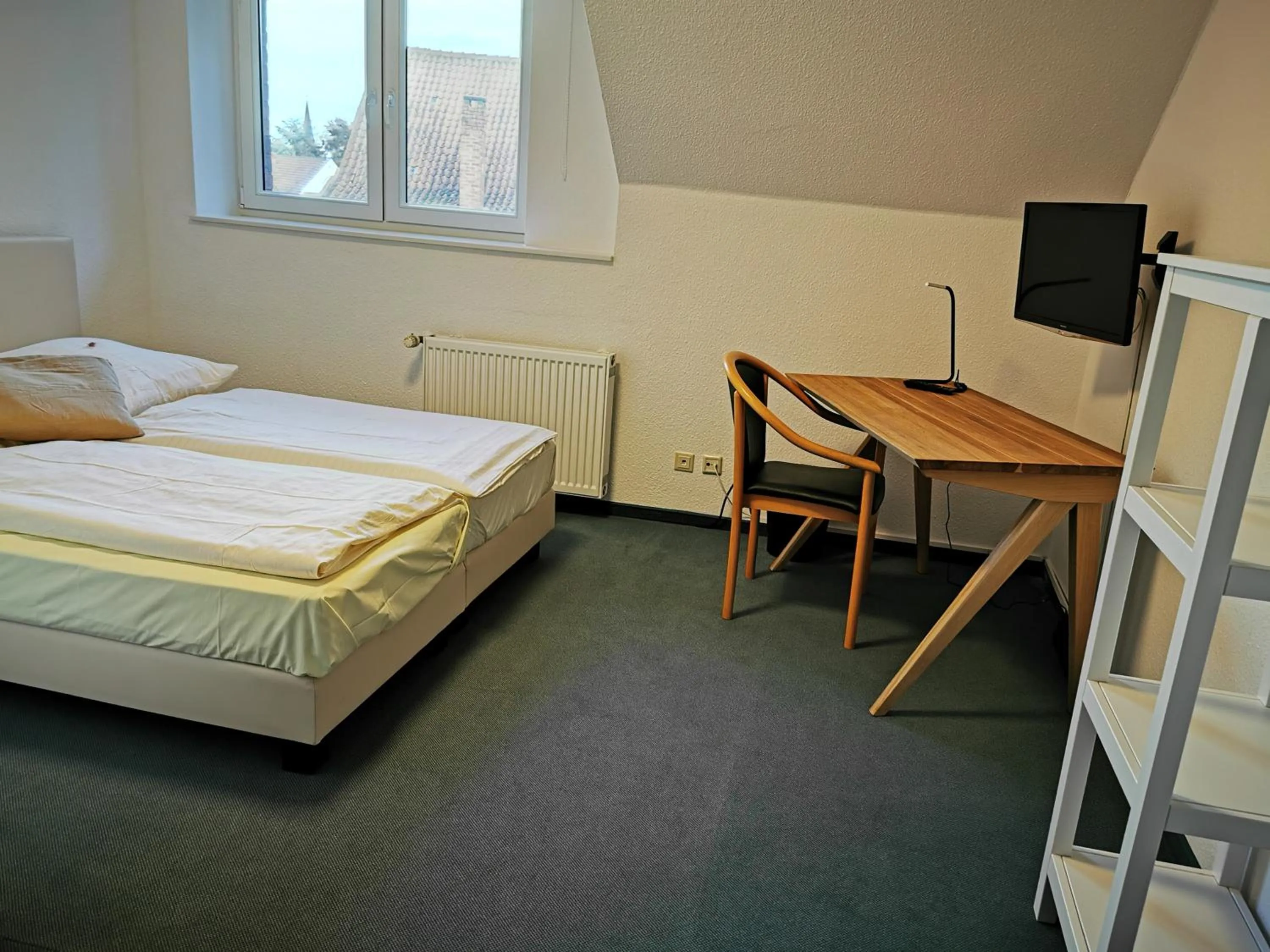 Photo of the whole room, Bed in Gästehaus Schlossgarten