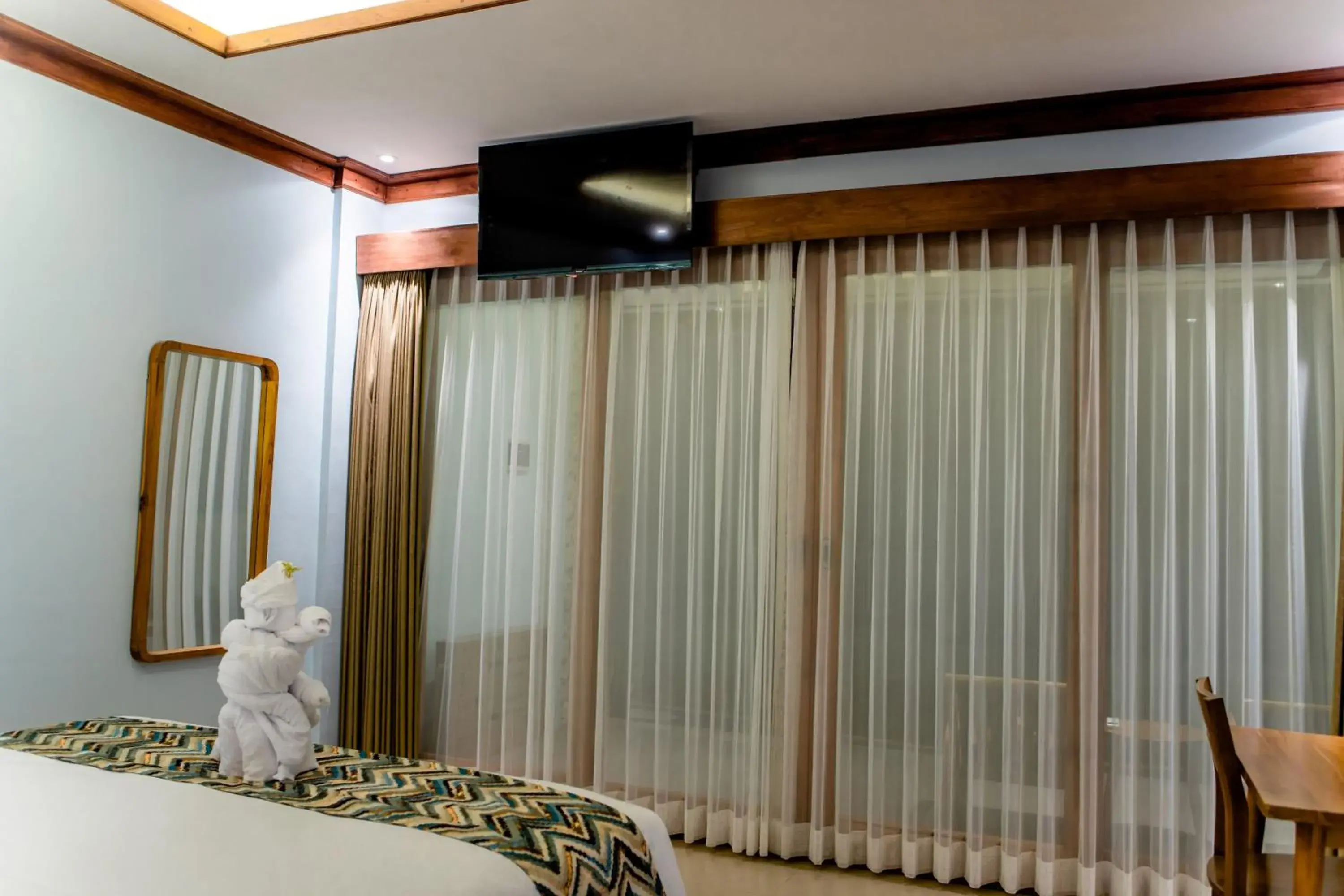 Bed in Blue Harbor Beachfront Villas & Resto Bed in Blue Harbor Beachfront Villas & Resto