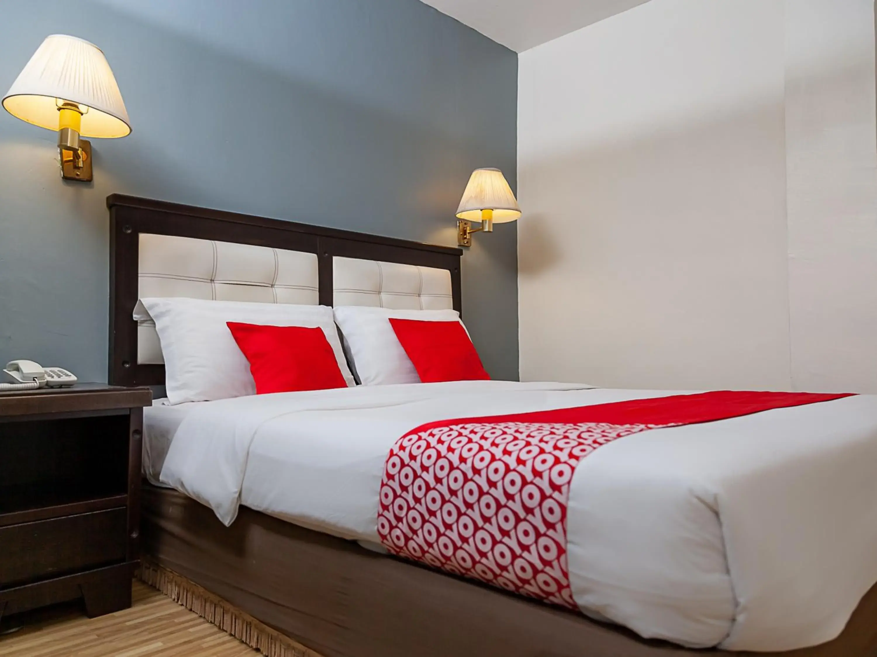 Bed in Super OYO 90055 Mansion Inn