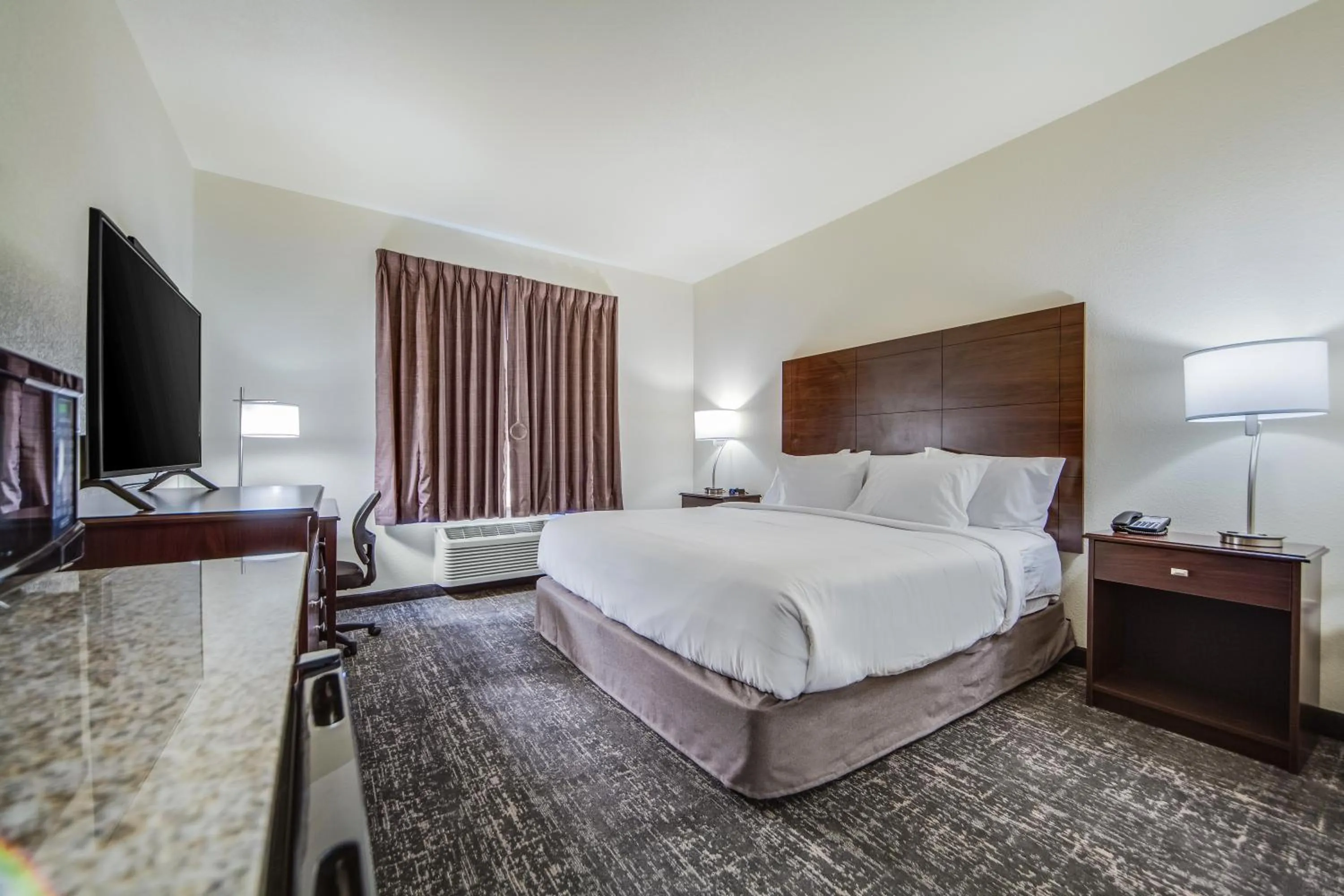 Bed in Cobblestone Hotel & Suites - Cozad